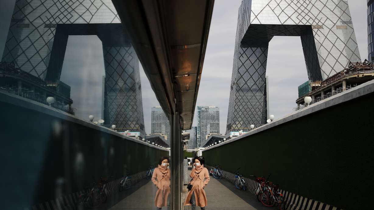 World economy may shrink because of virus, watchdog says