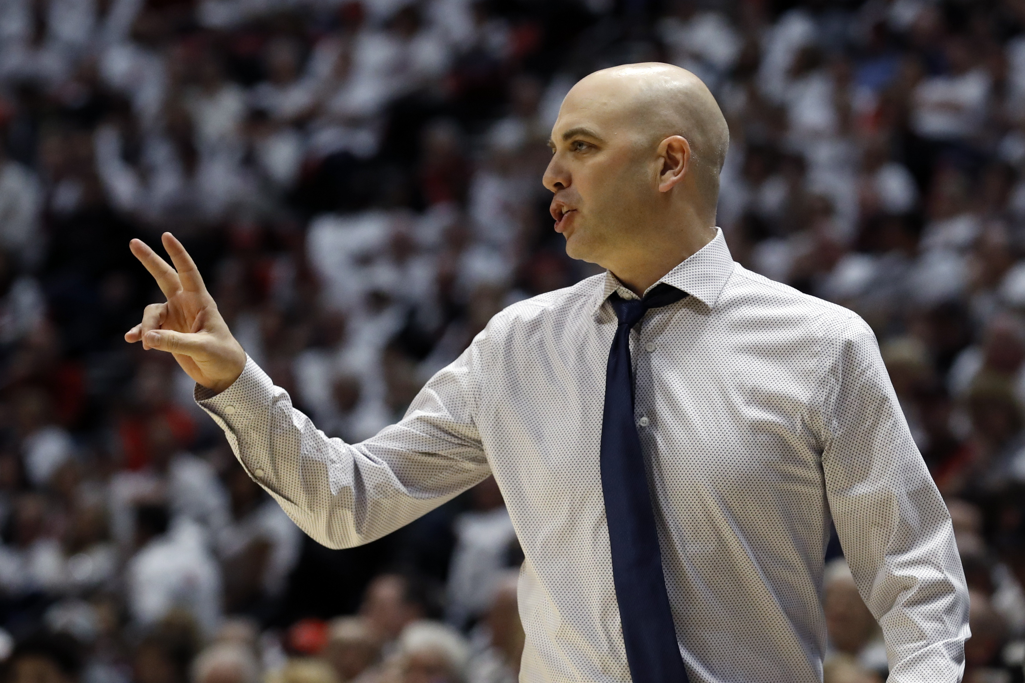 Utah State coach Craig Smith gestures during the first half of the team's NCAA college basketball game against San Diego State, Saturday, Feb. 1, 2020, in San Diego. Under a proposed 20-game conference schedule, the Aggies may get two fewer opportunities to schedule quality non-conference opponents. (Photo: Gregory Bull, AP)
