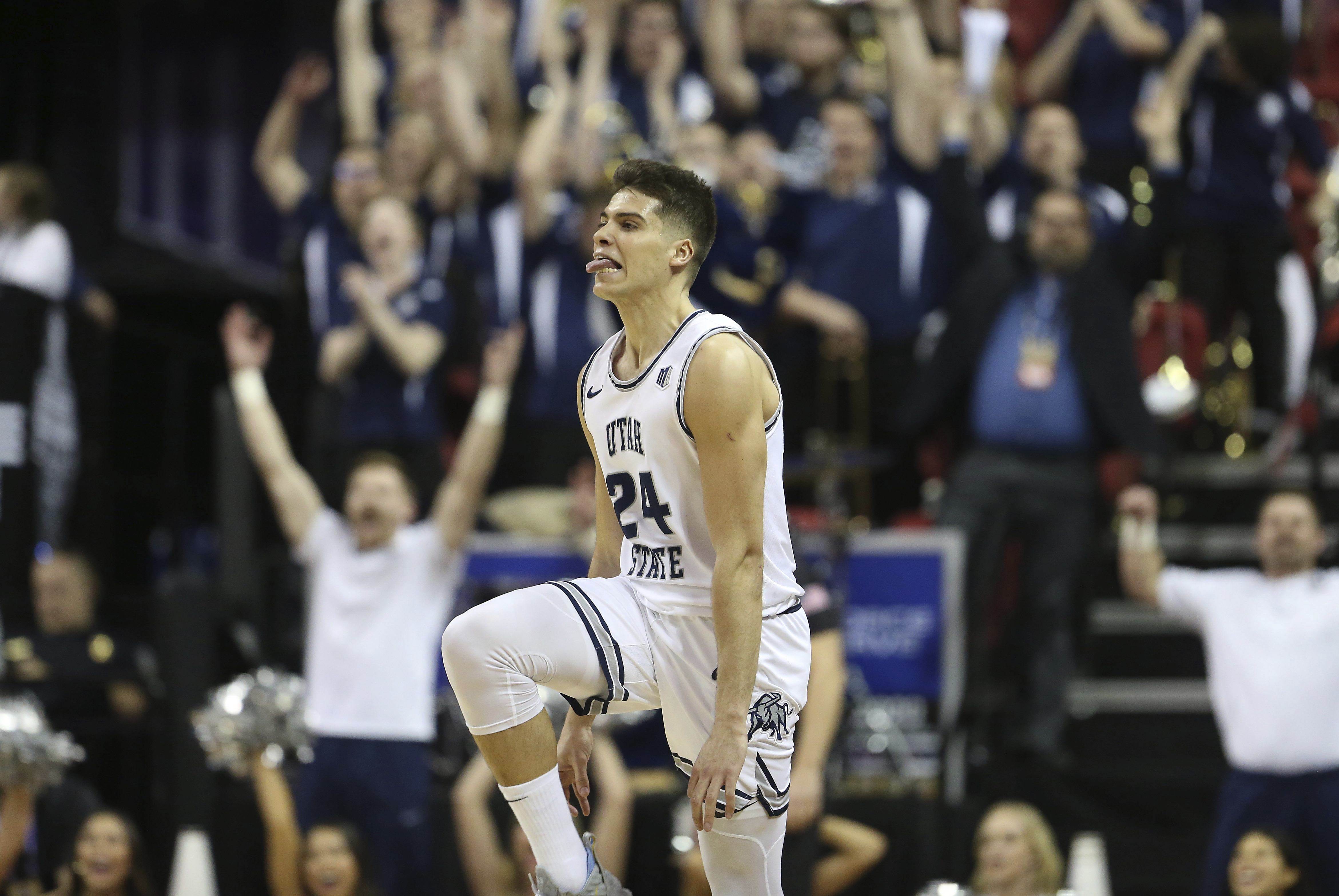 Utah State's Diogo Brito shoots against New Mexico during the first half of a Mountain West Conference tournament NCAA college basketball game Thursday, March 5, 2020, in Las Vegas. (AP Photo/Isaac Brekken)