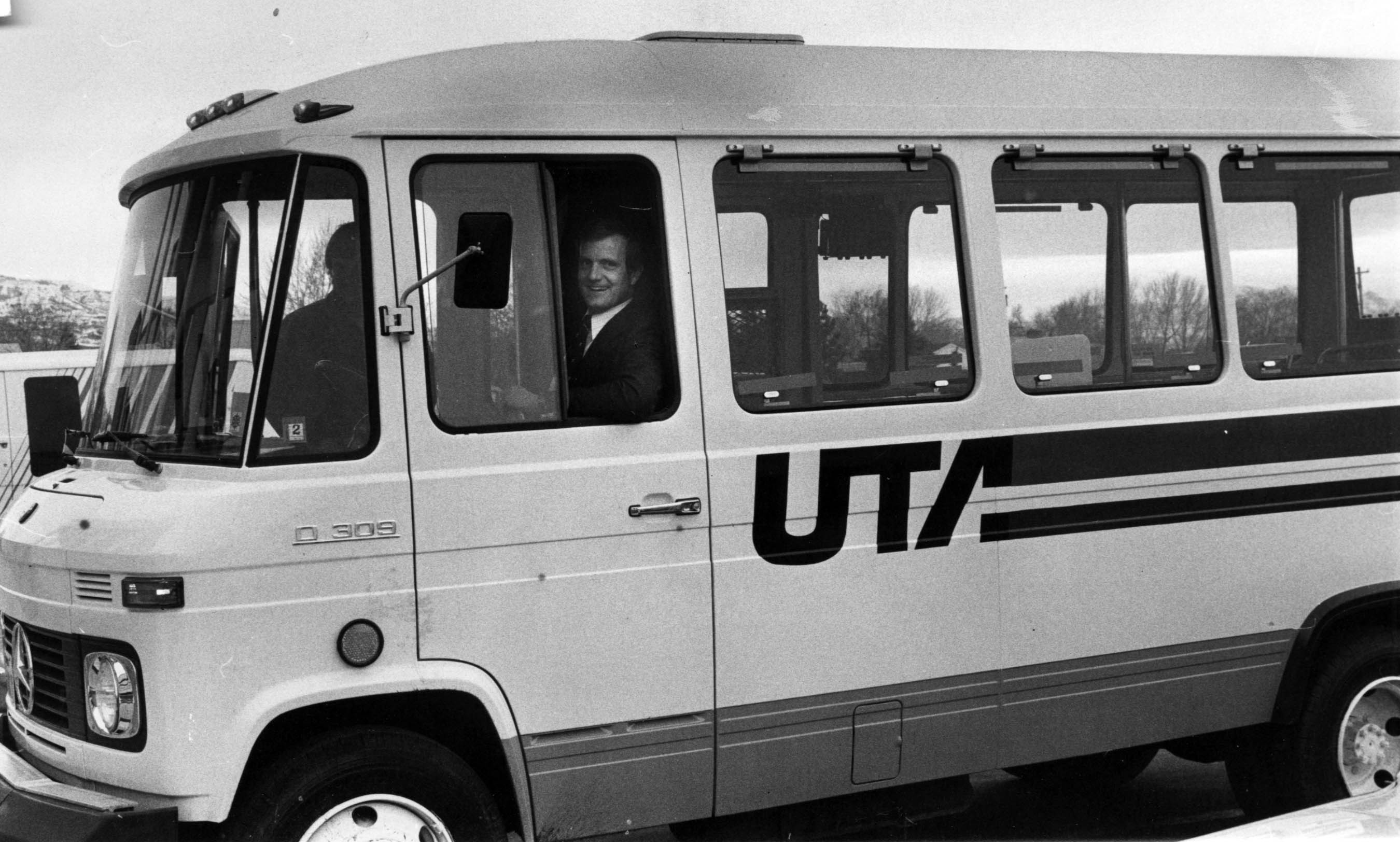 UTA General Manager John Pingree takes the helm of mini-bus made by Mercedes of West Germany to be added to the fleet. March 1979. (KSL Archives)