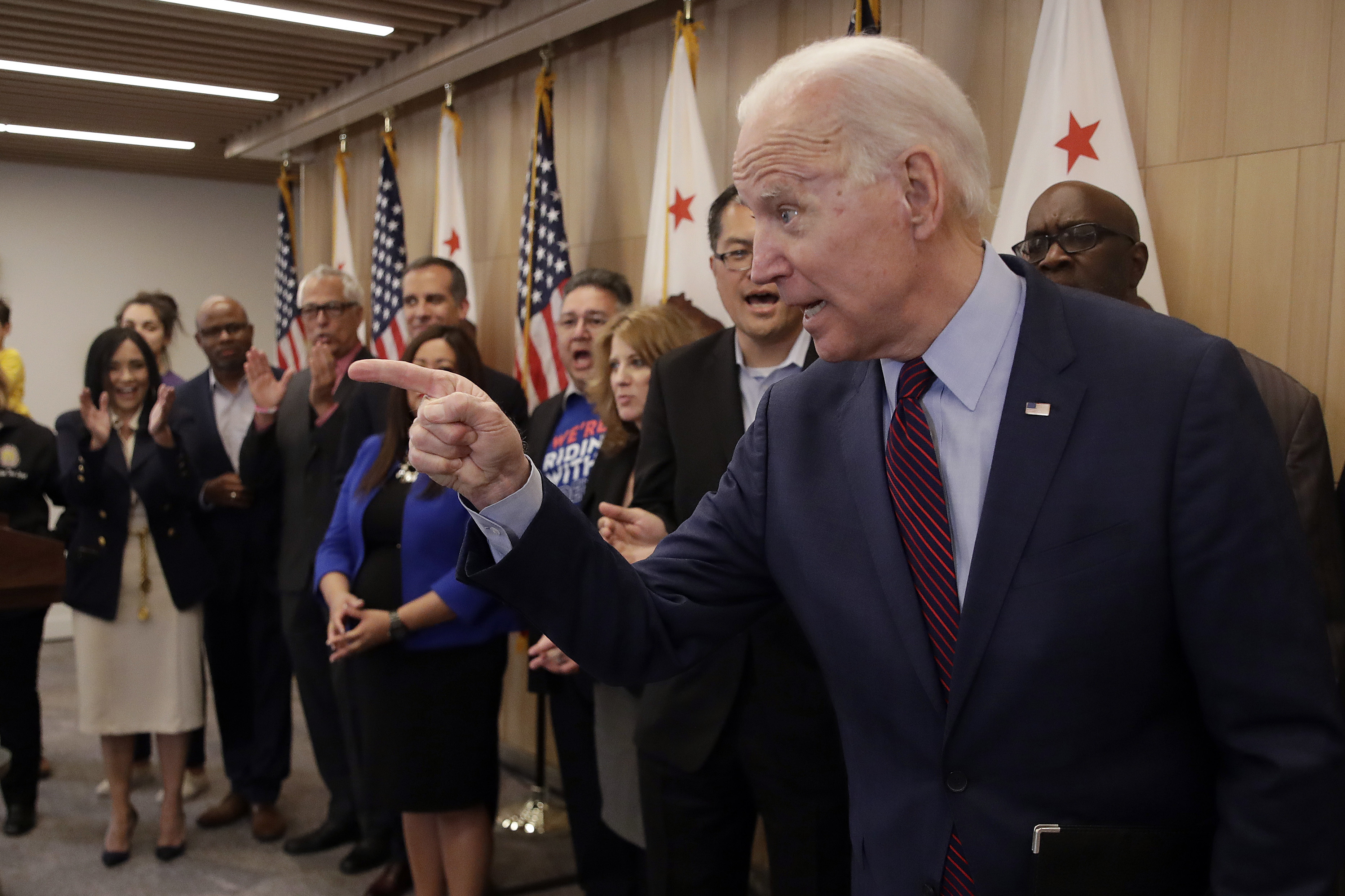 Biden invokes Obama, swipes at Sanders with six-state ad buy