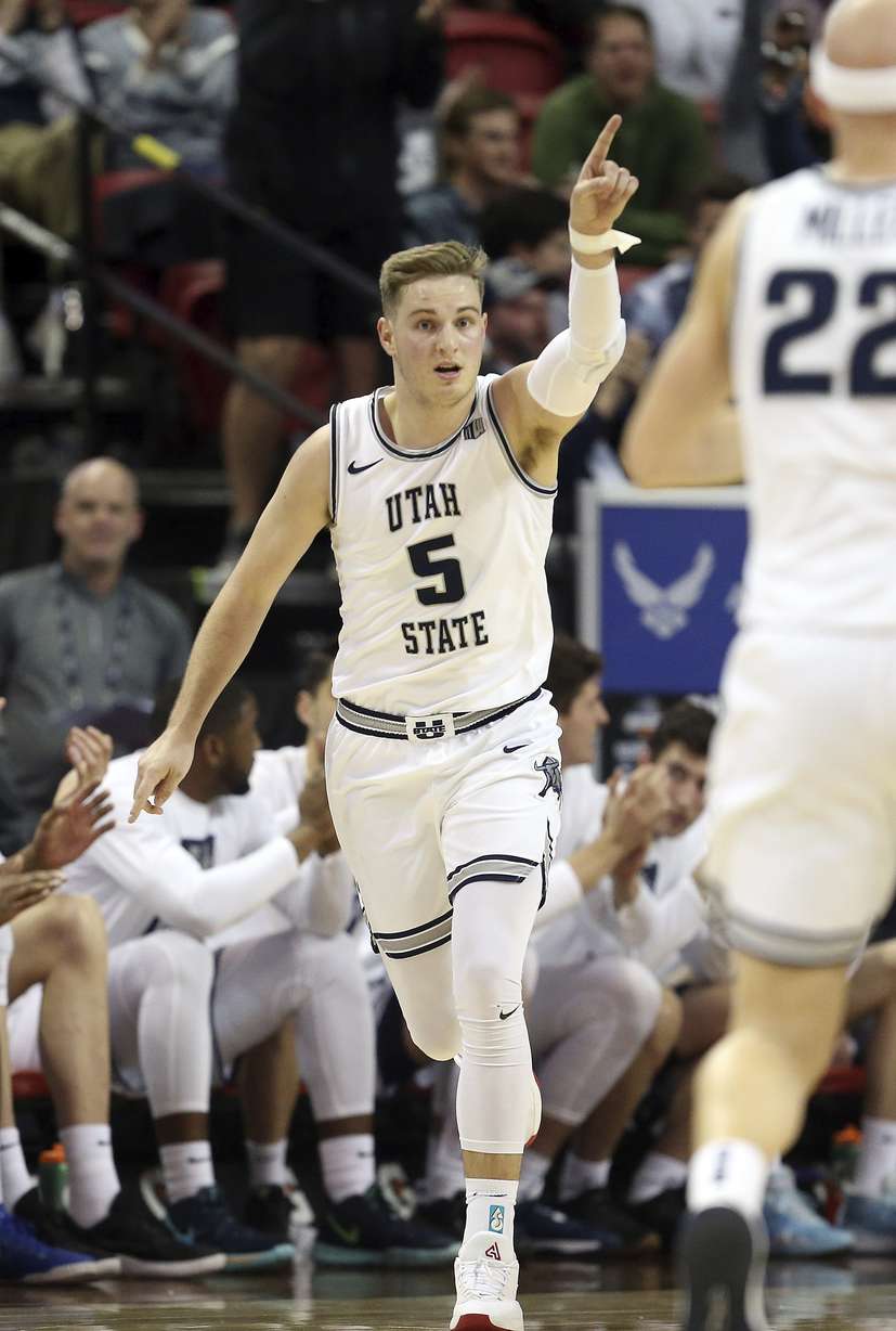 Utah State's Sam Merrill gestures after scoring against Wyoming during the second half of an NCAA college basketball game in the Mountain West Conference men's tournament Friday, March 6, 2020, in Las Vegas. Utah State won 89-82. (Photo: Isaac Brekken, AP)