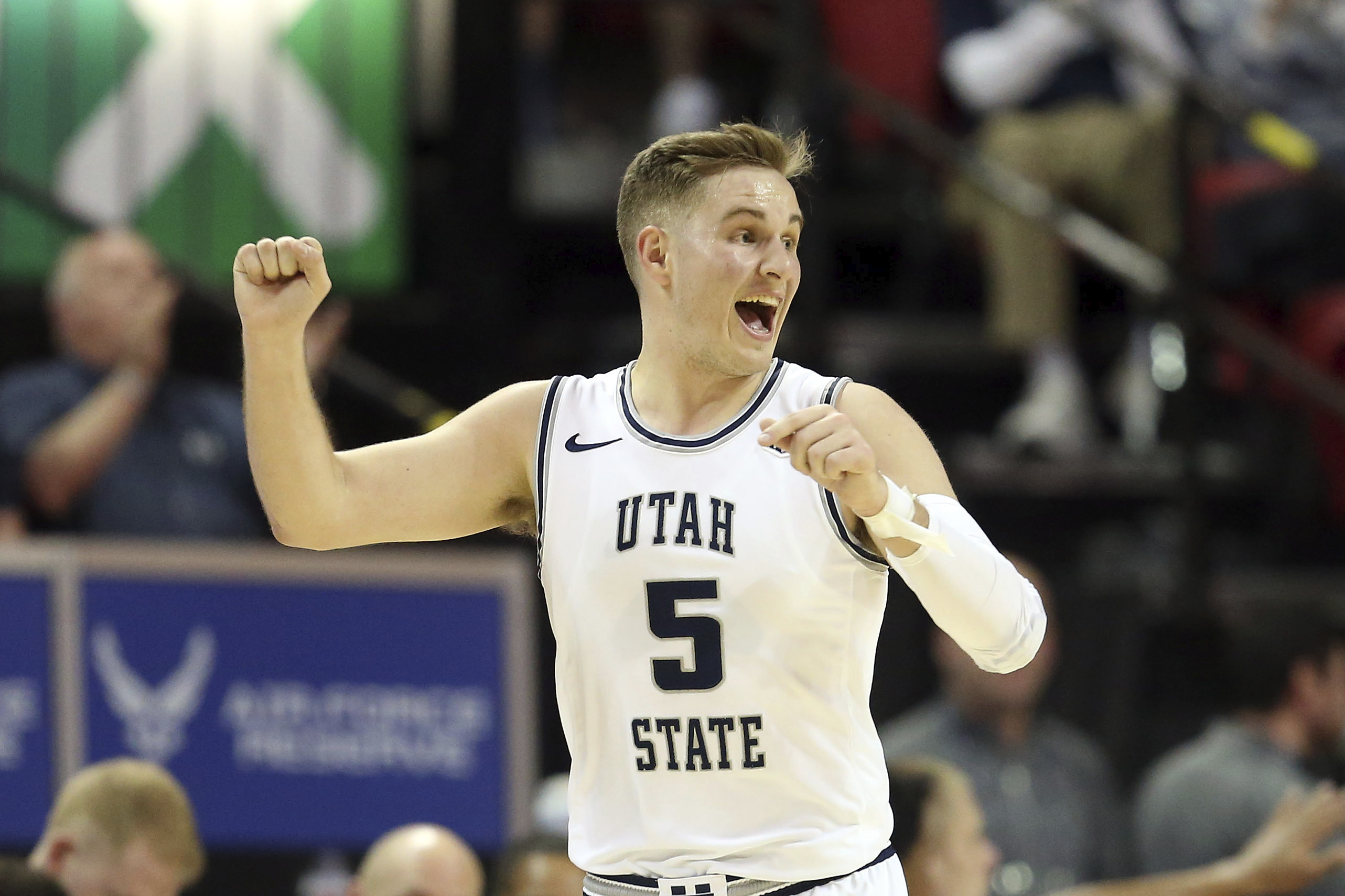 Utah State's Sam Merrill plays against Wyoming during the second half of an NCAA college basketball game in the Mountain West Conference men's tournament Friday, March 6, 2020, in Las Vegas. (AP Photo/Isaac Brekken)