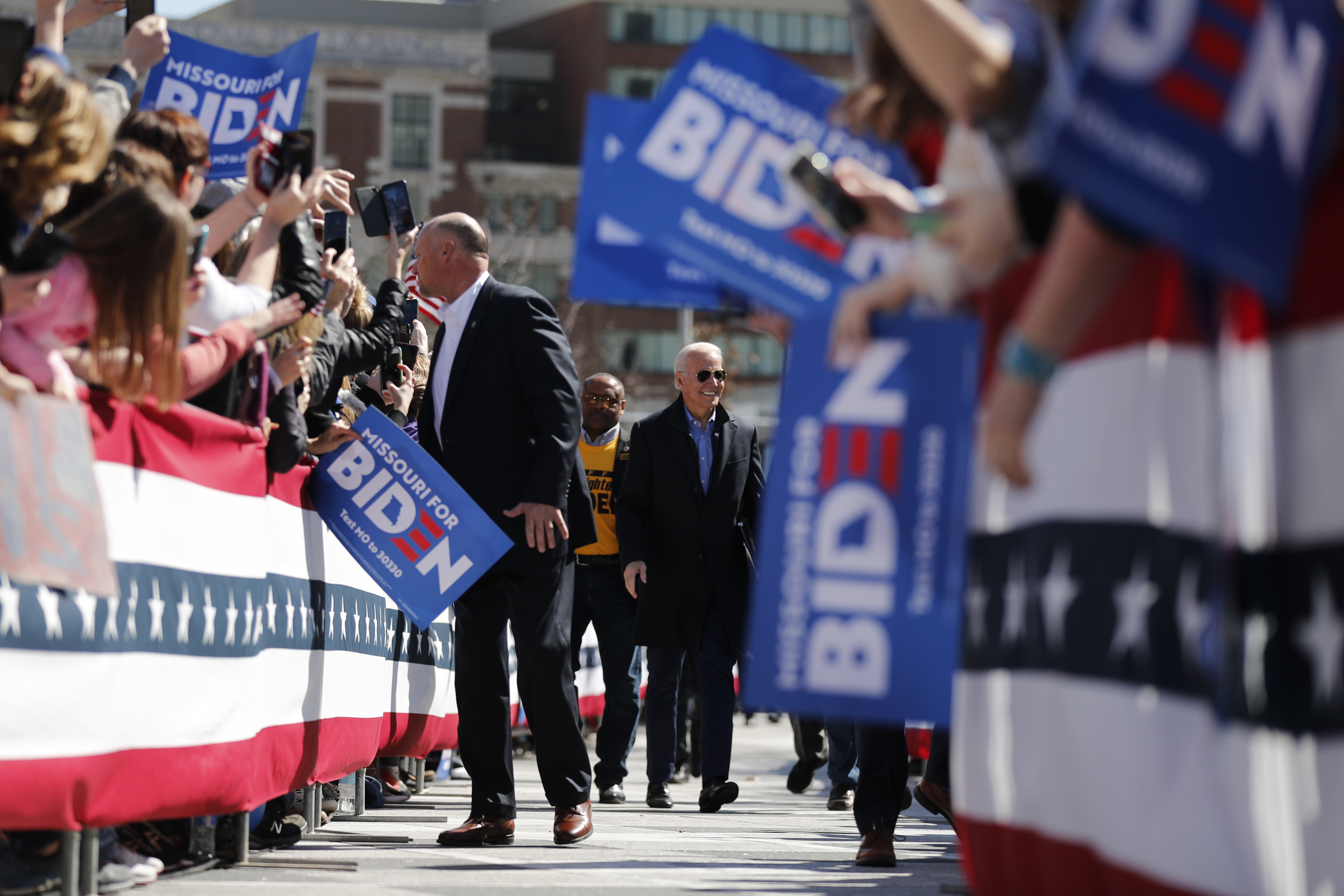 Democratic presidential candidate former Vice President Joe Biden is greeted by supporters as he approaches the stage to speak at a campaign rally Saturday, March 7, 2020, in St. Louis. (Photo: Jeff Roberson, Associated Press)