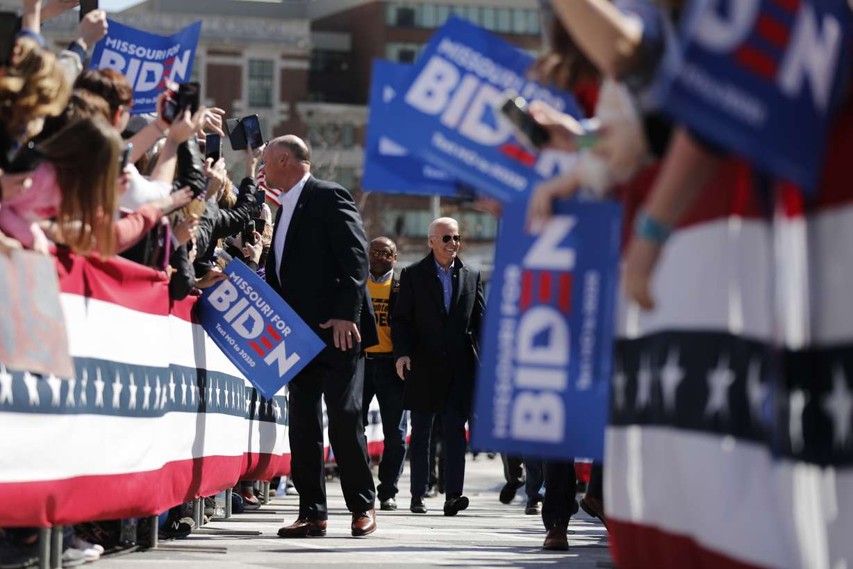 Democratic presidential candidate former Vice President Joe Biden is greeted by supporters as he approaches the stage to speak at a campaign rally Saturday, March 7, 2020, in St. Louis. (Photo: Jeff Roberson, Associated Press)