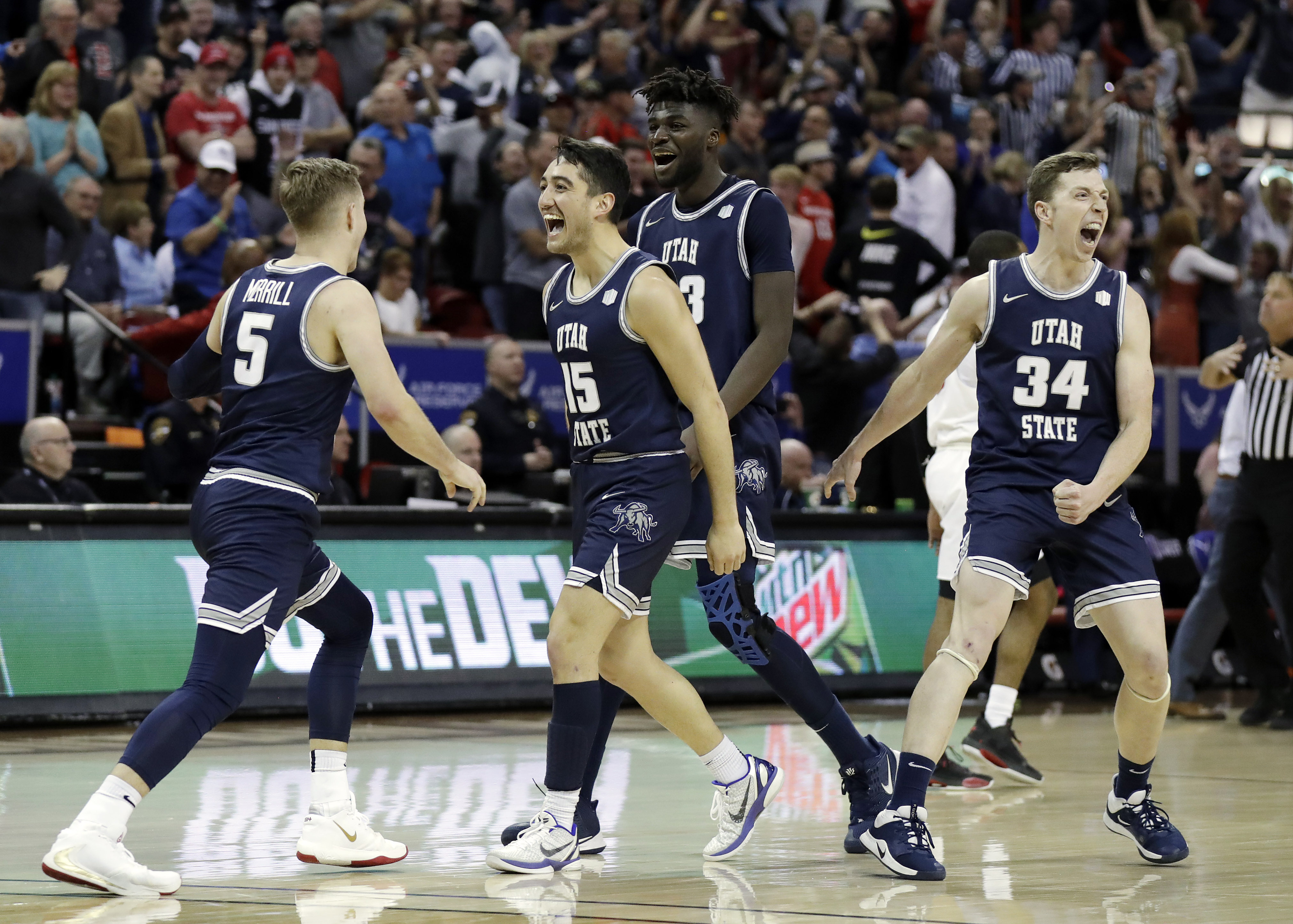 Utah State reacts after Sam Merrill (5) sunk a 3-point basket with seconds remaining in the second half of an NCAA college basketball game for the Mountain West Conference men's tournament championship Saturday, March 7, 2020, in Las Vegas. (Photo: Isaac Brekken, Associated Press)