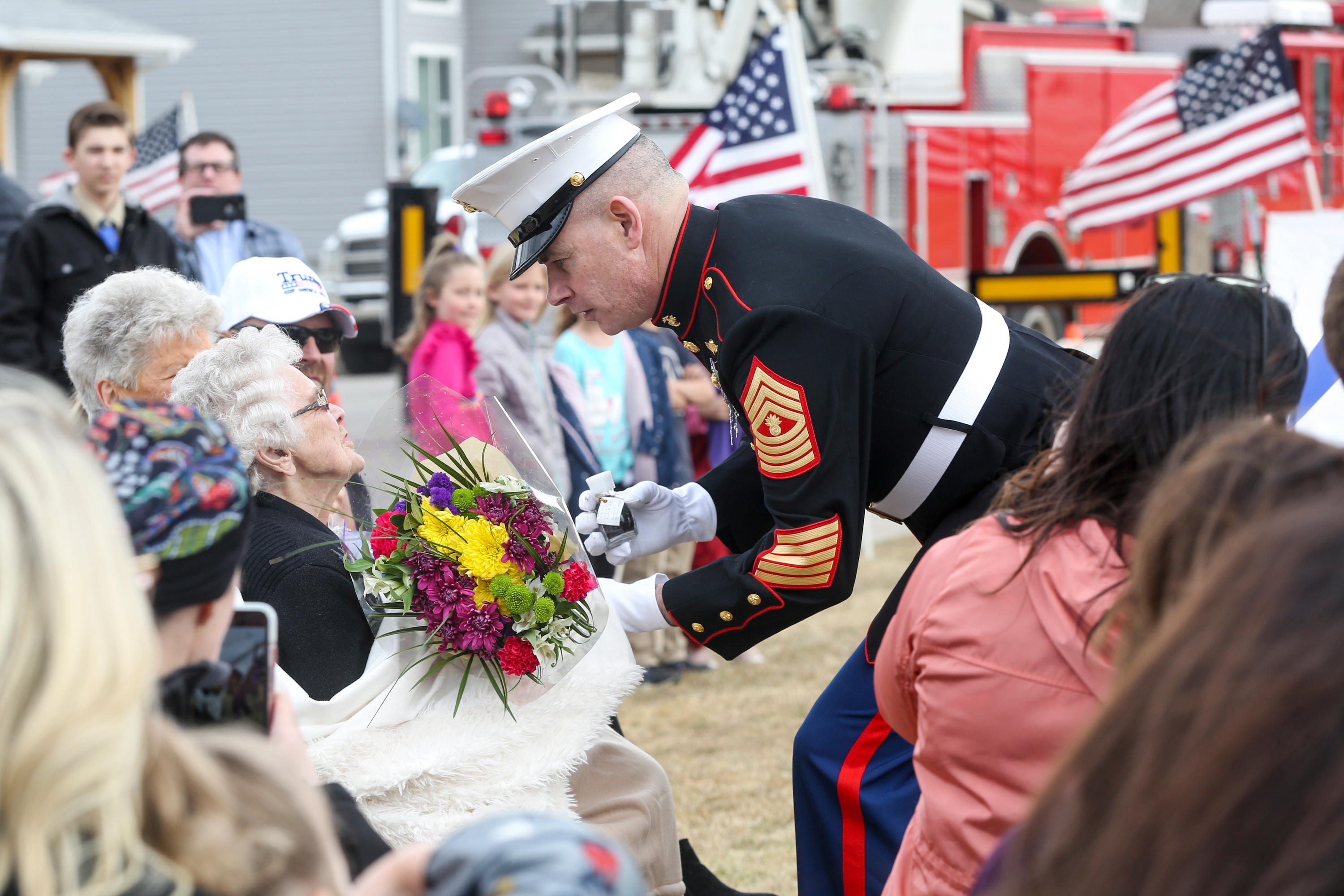 Master Gunnery Sgt. Brian Ivers presents a bouquet of flowers to Betty Jones during the dedication of a memorial park for the 75th anniversary of the Battle of Iwo Jima on Saturday, March 7, 2020. Jones is the widow of Pfc. James Richard “Dick” Jones, who fought in the battle. His brother, Pvt. Kay “Pete” Murdock Jones, was killed. The two brothers had enlisted in the Marine Corps together. (Ivy Ceballo, KSL)