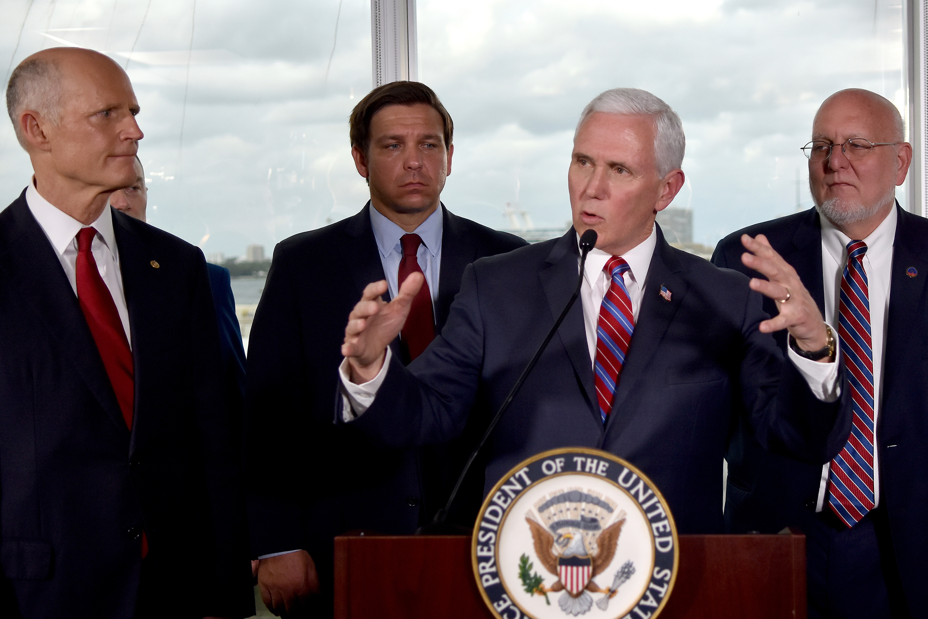 Vice President Mike Pence, center, along with Florida Sen. Rick Scott, far left, and Gov. Ron DeSantis, left, and CDC Director Dr. Robert Redfield, right, speaks to the media after a meeting with cruise line company leaders to discuss the efforts to fight the spread of the COVID-19 coronavirus, at Port Everglades, Saturday March 7, 2020, in Fort Lauderdale, Fla. (Photo: Gaston De Cardenas, AP Photo)