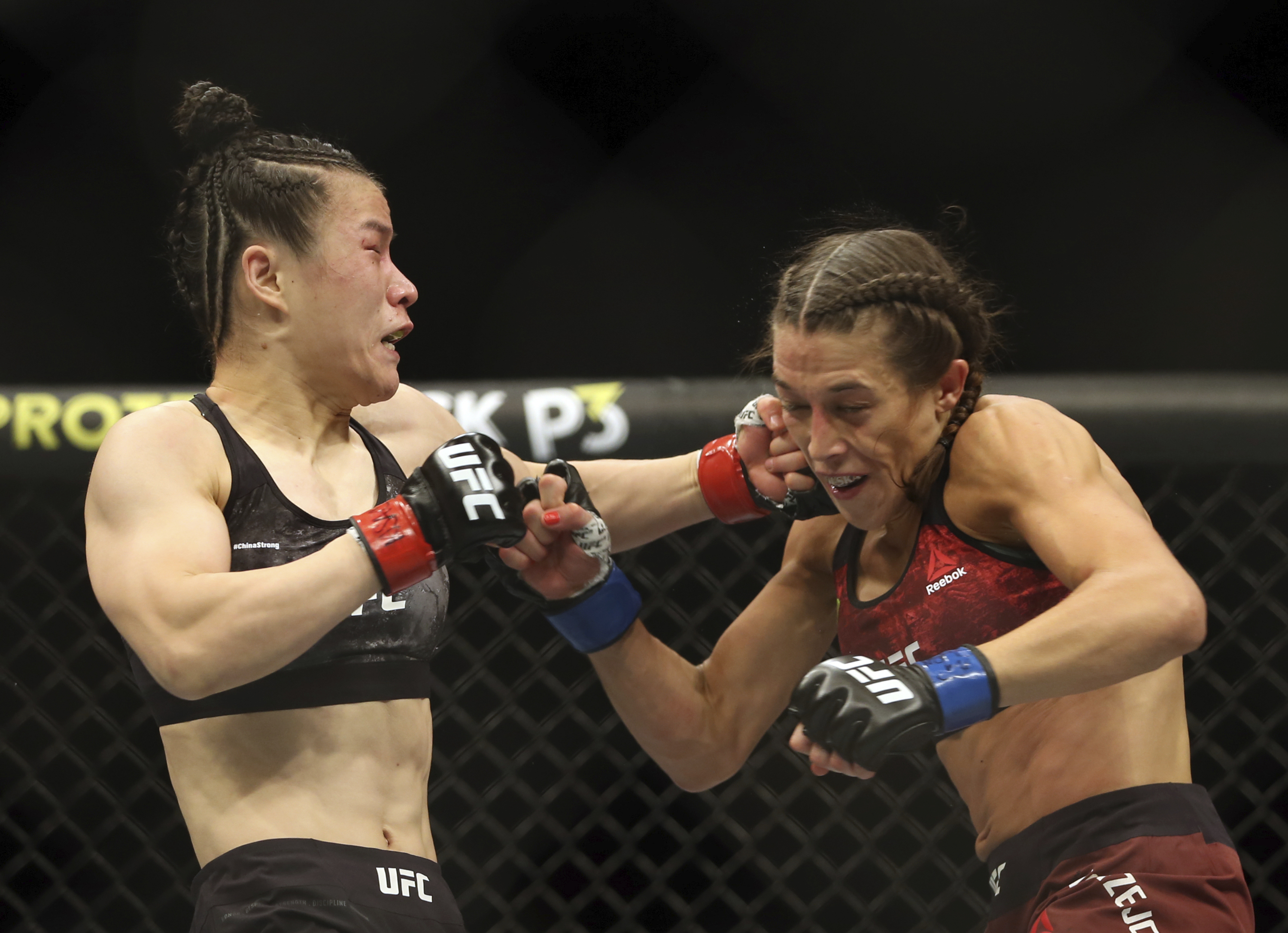 Zhang Weili, Israel Adesanya keep title belts at UFC 248