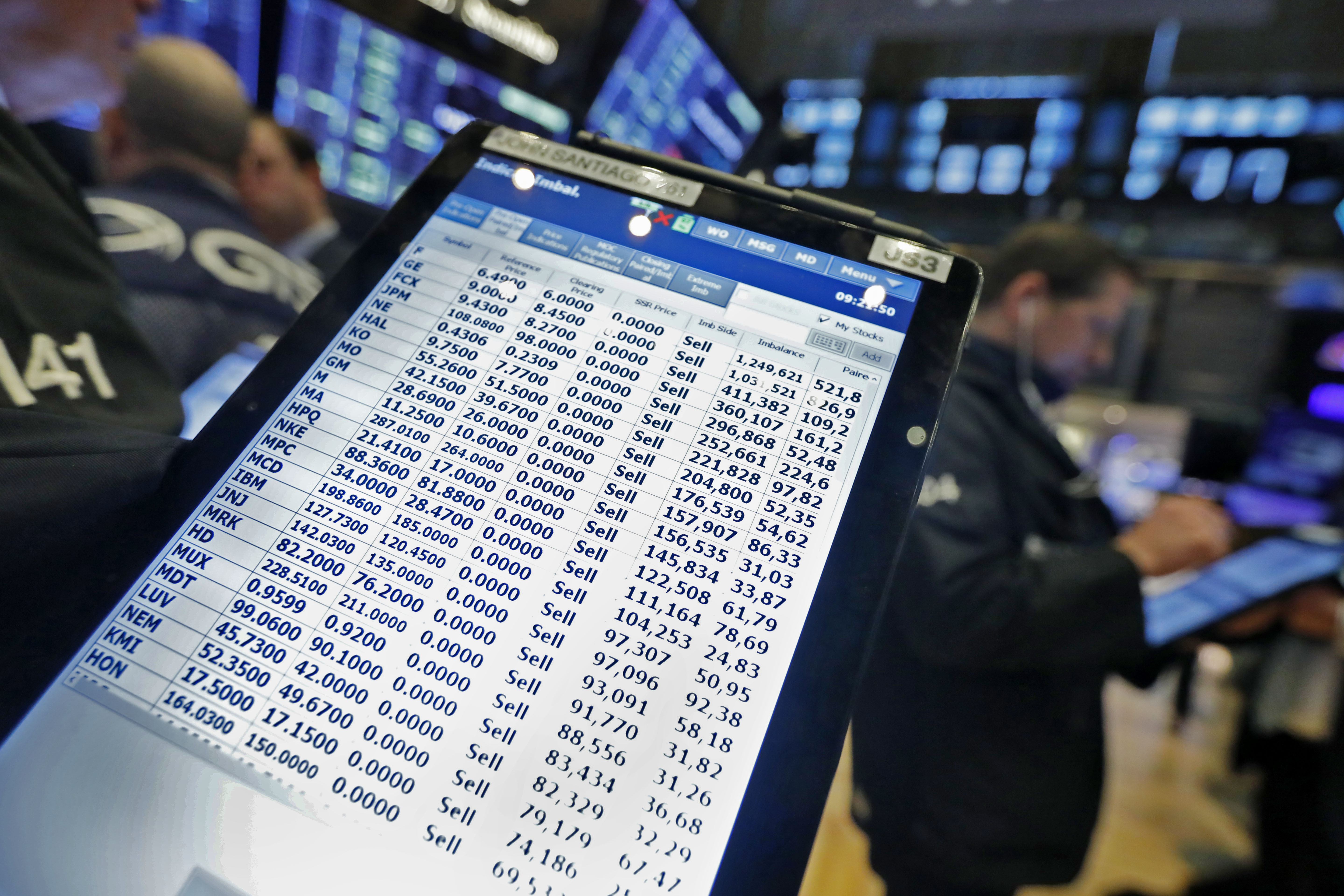 Trader Gregory Rowe prepares for the day's activity on the floor of the New York Stock Exchange, Monday, March 9, 2020. Trading in Wall Street futures has been halted after they fell by more than the daily limit of 5%. (Richard Drew, AP Photo)