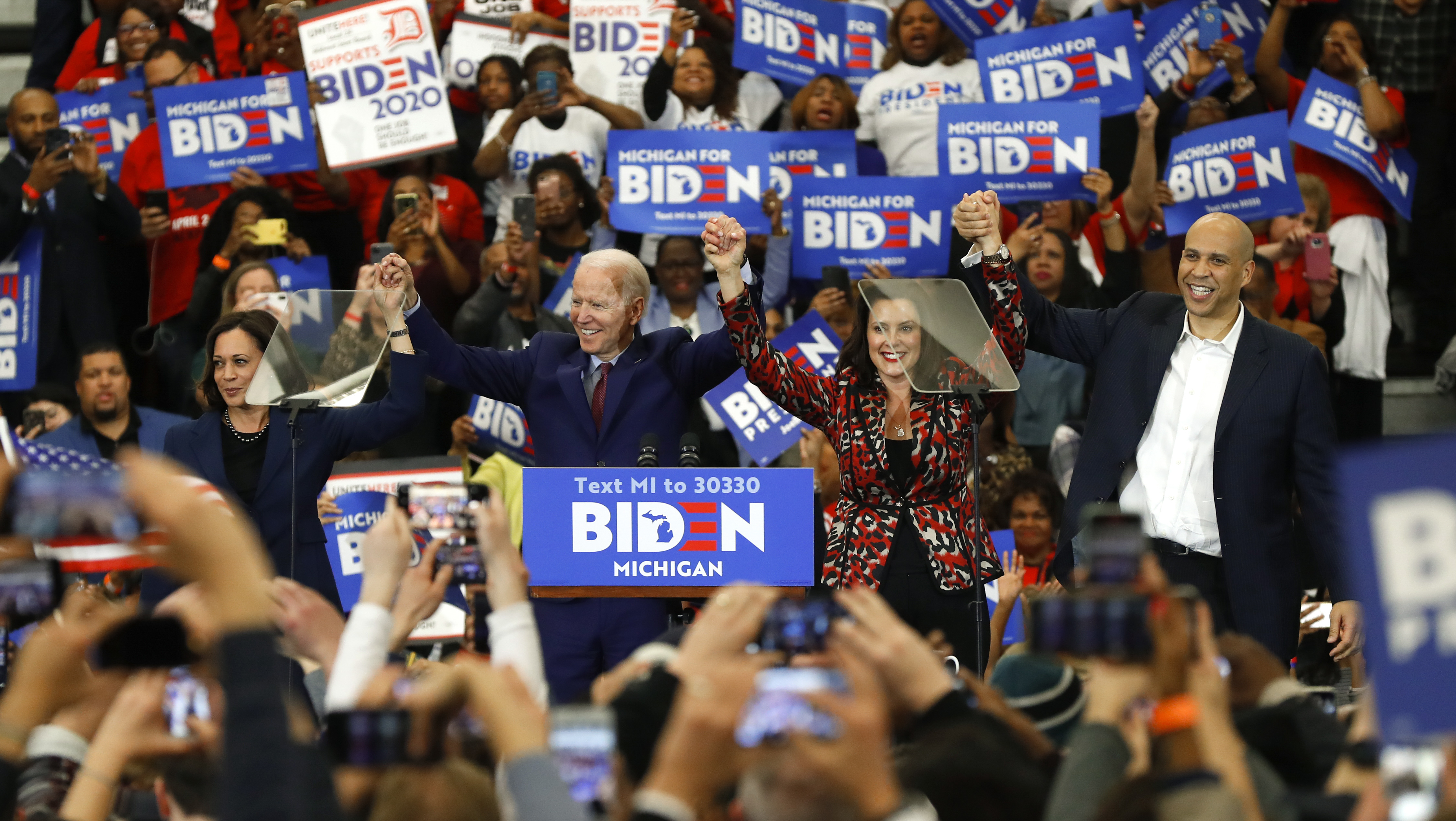 Sen. Kamala Harris, D-Calif., from left, Democratic presidential candidate former Vice President Joe Biden, Michigan Gov. Gretchen Whitmer, and Sen. Cory Booker D-N.J. greet the crowd during a campaign rally at Renaissance High School in Detroit, Monday, March 9, 2020. (Paul Sancya, AP Photo)