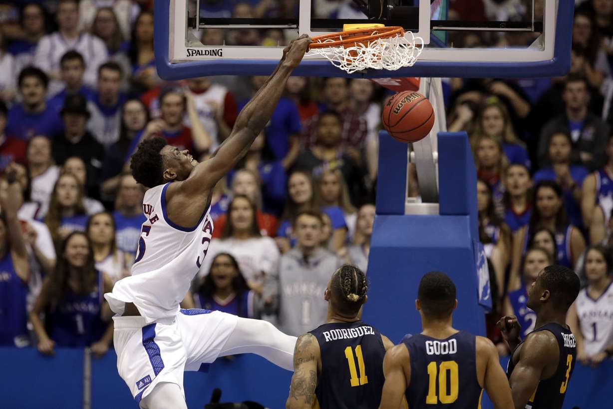 FILE - In this Nov. 19, 2019, file photo, Kansas center Udoka Azubuike (35) dunks the ball during the second half of an NCAA college basketball game against East Tennessee State in Lawrence, Kan. Azubuike was selected to the Associated Press All-Big 12 first team announced Tuesday, March 10, 2020. Azubuike was also named the AP Big 12 Player of the Year.