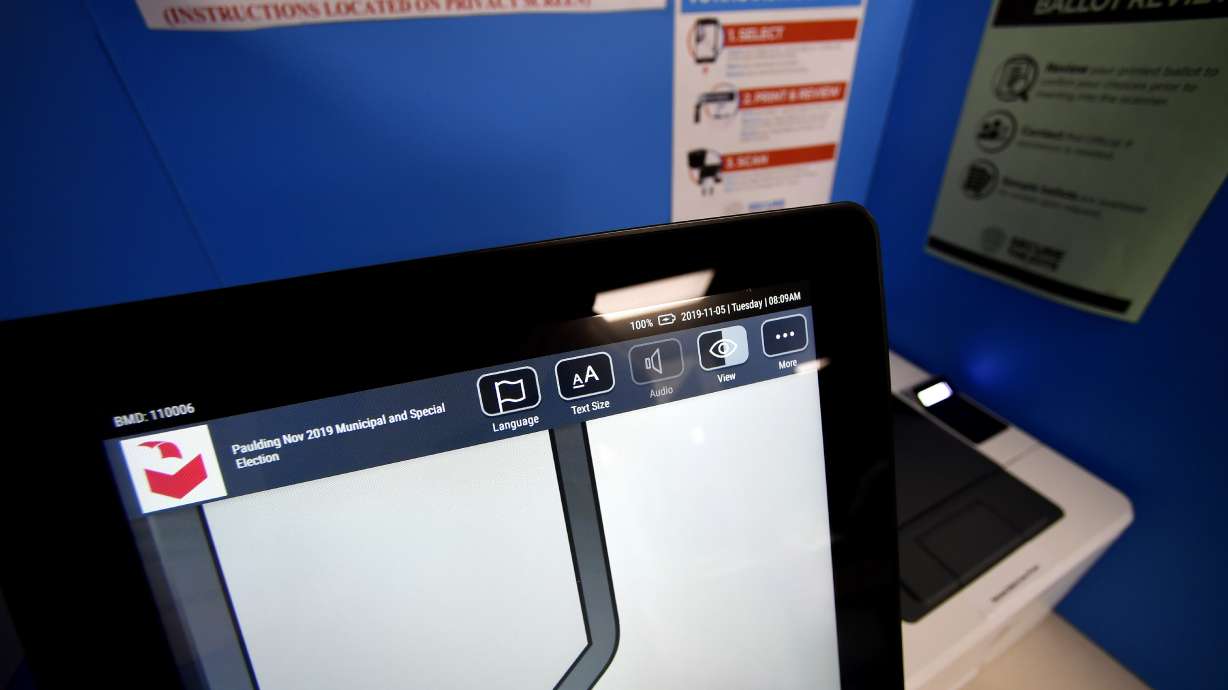 Georgia county punished for ditching voting machines