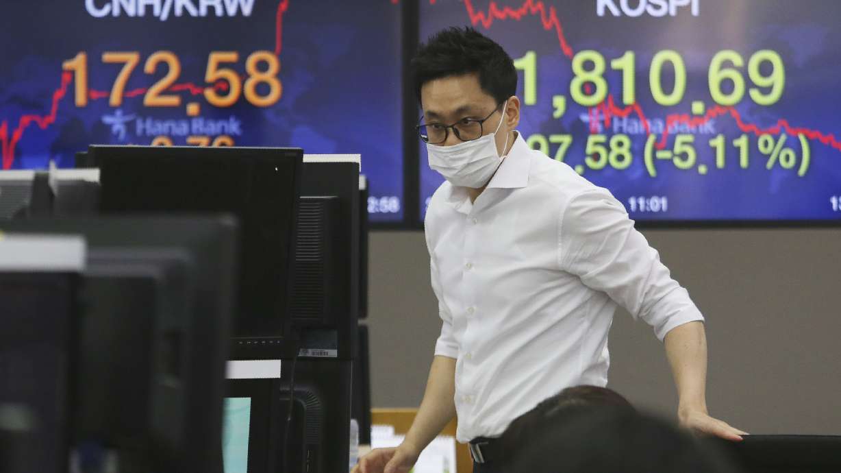 The Latest: Investors unsure how virus will impact profits