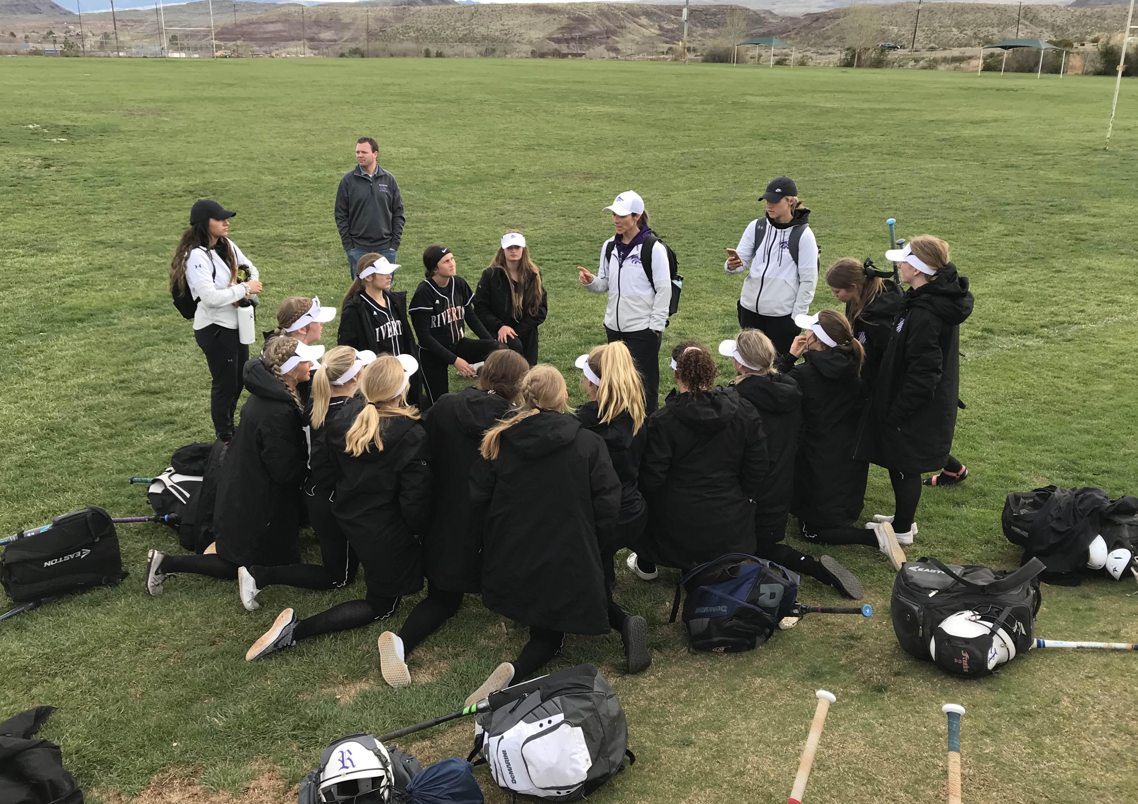 Riverton softball coach Katelyn Elliott speaks to the Silverwolves after a win over Skyridge, Saturday, Mrach 14, 2020 in the Silverwolves' final game before a two-week suspension on high school sports, as announced by the Utah High School Activities Association and Gov. Gary Herbert's office. (Photo: Sean Walker, KSL.com)