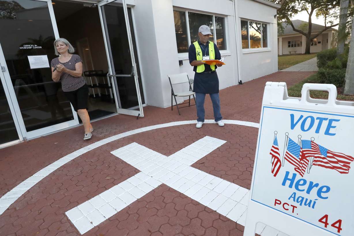 A voter uses hand sanitizer as she leaves a polling station for the Florida presidential primary, Tuesday, March 17, 2020, in Bonita Springs, Fla. Floridians are voting across the state as election officials manage losses of poll workers and changes to polling places because of the coronavirus. There had been concern some polling places might not open on time Tuesday because of worker absences, but no problems have been reported. (Elise Amendola, AP Photo)