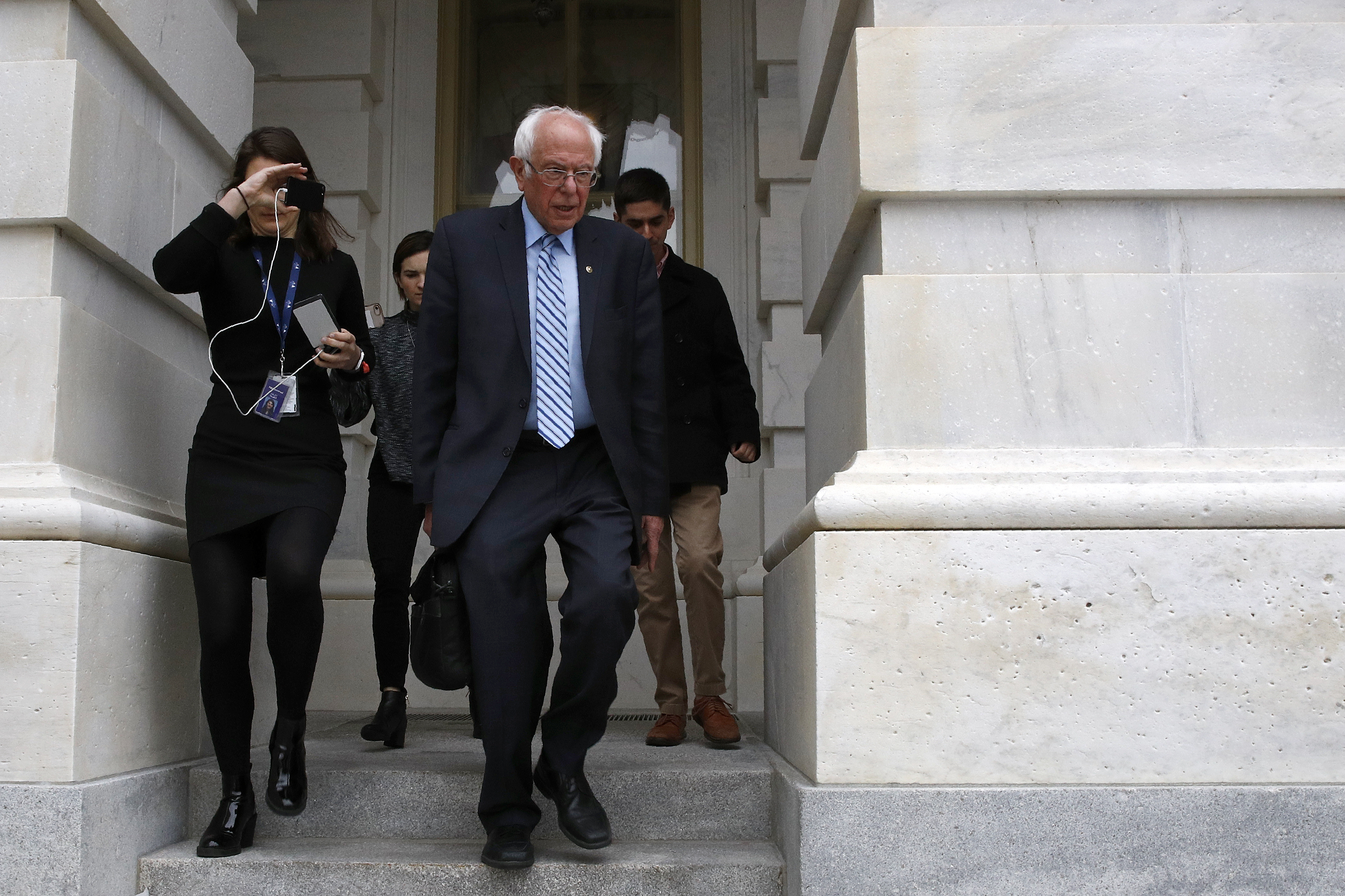 Democratic presidential candidate Sen. Bernie Sanders, I-Vt., departs Capitol Hill in Washington, Wednesday, March 18, 2020, after the Senate passed a second coronavirus response bill. (AP Photo/Patrick Semansky)