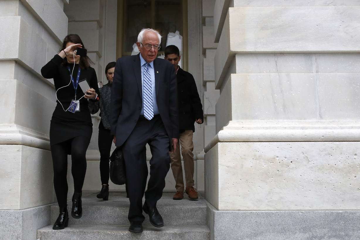 Democratic presidential candidate Sen. Bernie Sanders, I-Vt., departs Capitol Hill in Washington, Wednesday, March 18, 2020, after the Senate passed a second coronavirus response bill. (AP Photo/Patrick Semansky)