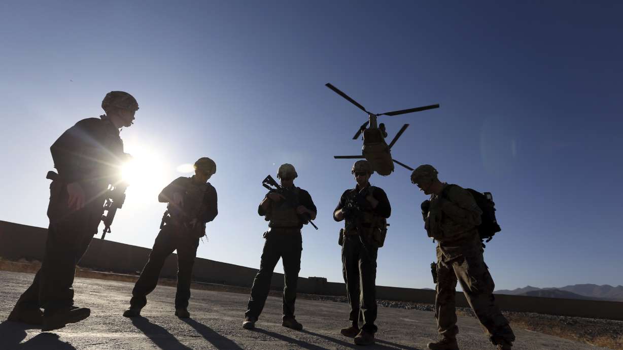 US pauses Afghanistan deployments, isolates arrivals there