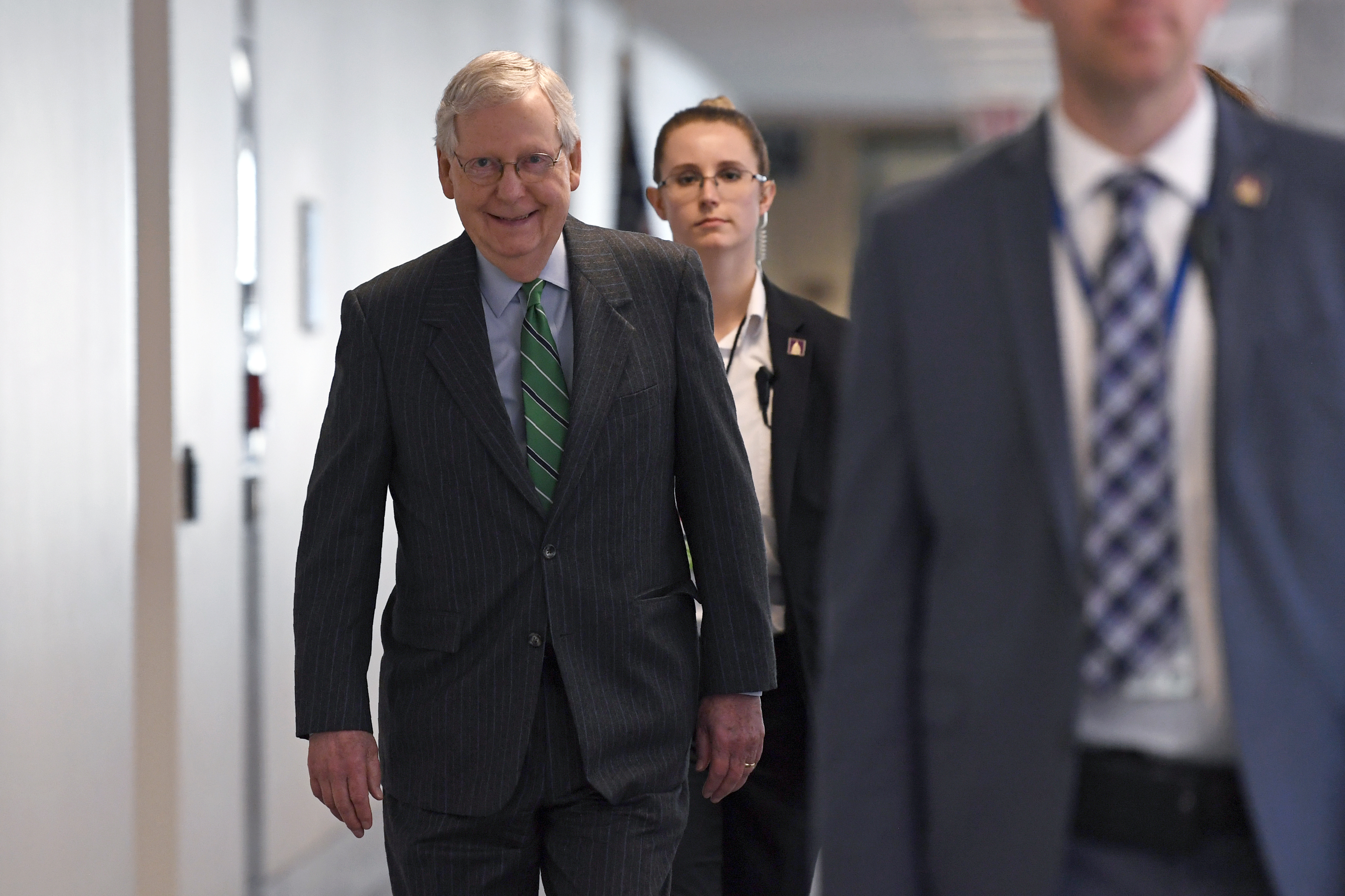 Senate Majority Leader Mitch McConnell of Ky., walk to attend a Republican policy lunch on Capitol Hill in Washington, Thursday, March 19, 2020. (AP Photo/Susan Walsh)