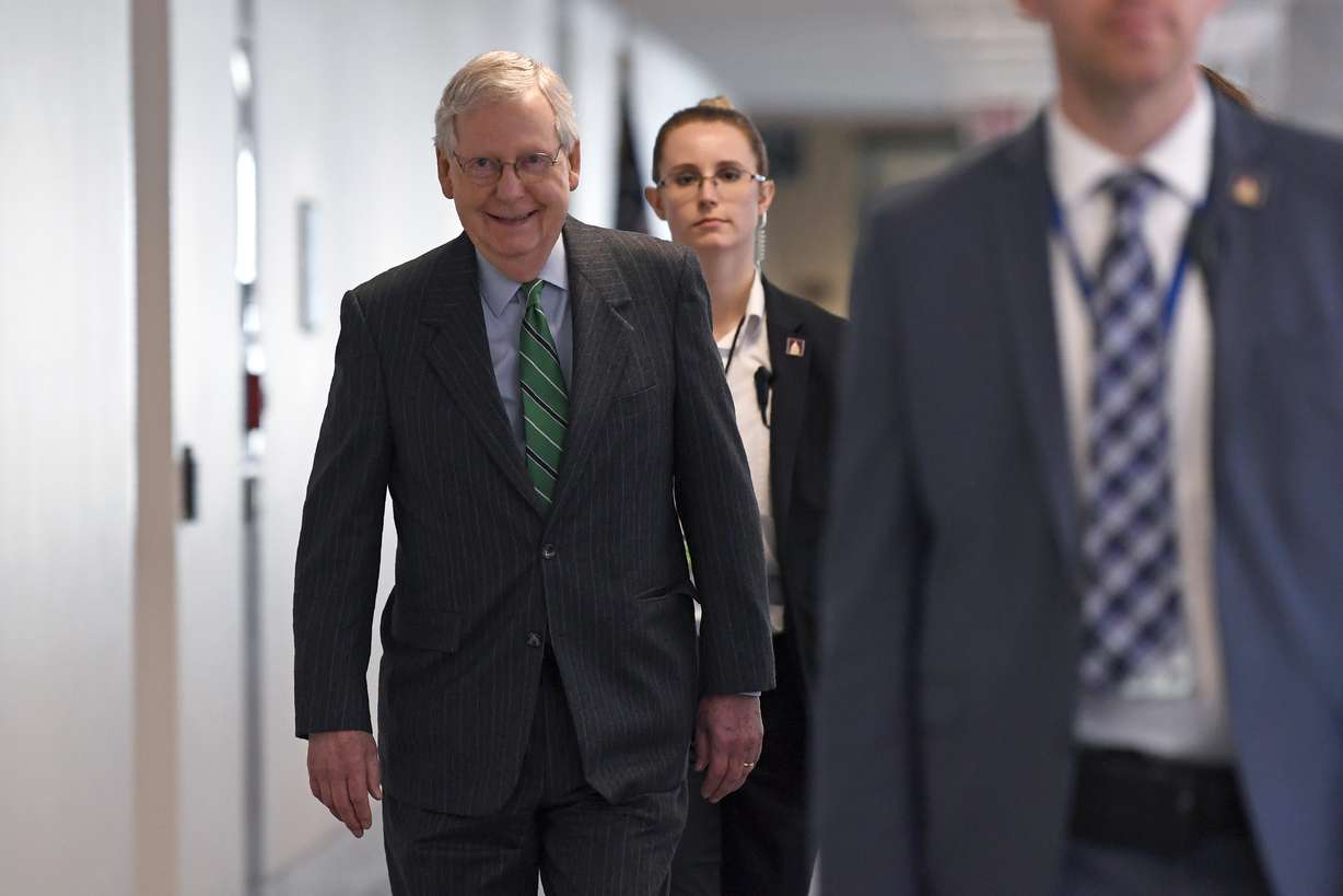 Senate Majority Leader Mitch McConnell of Ky., walk to attend a Republican policy lunch on Capitol Hill in Washington, Thursday, March 19, 2020. (AP Photo/Susan Walsh)