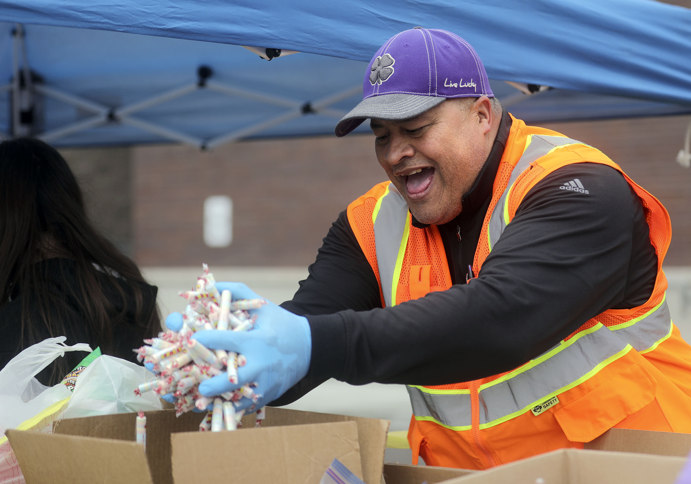 Thousands flock to grab-and-go food banks in the wake of layoffs, school closures