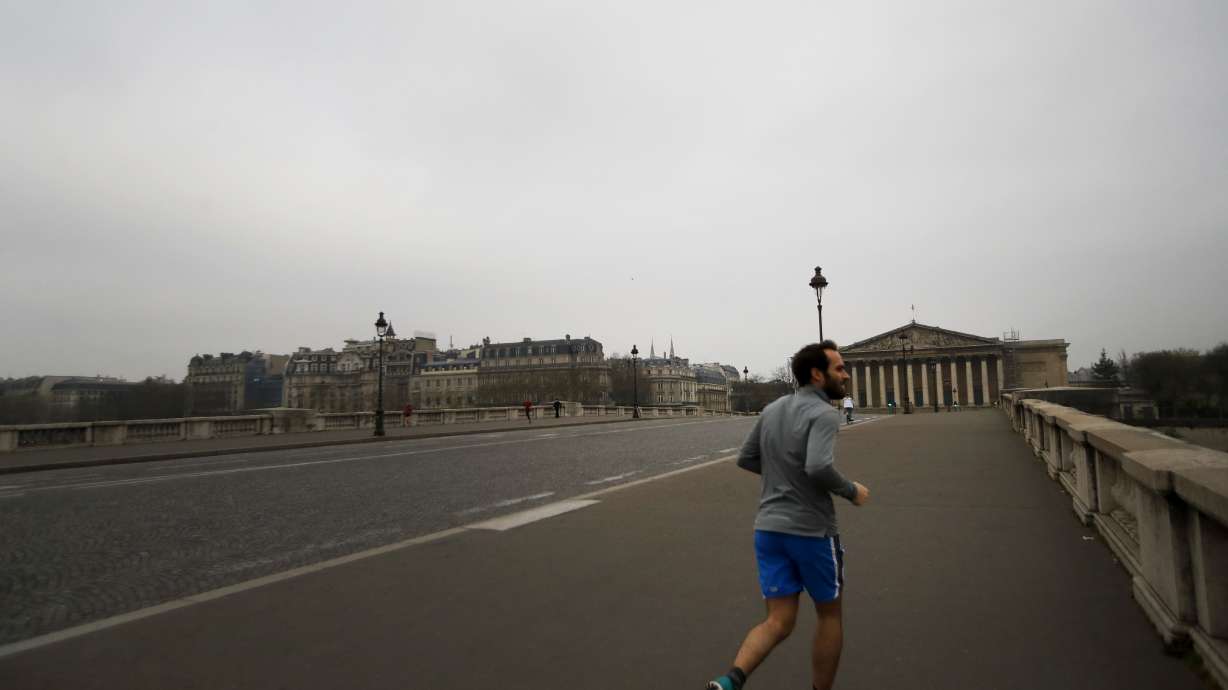 Confined by virus, Frenchman runs marathon on his balcony