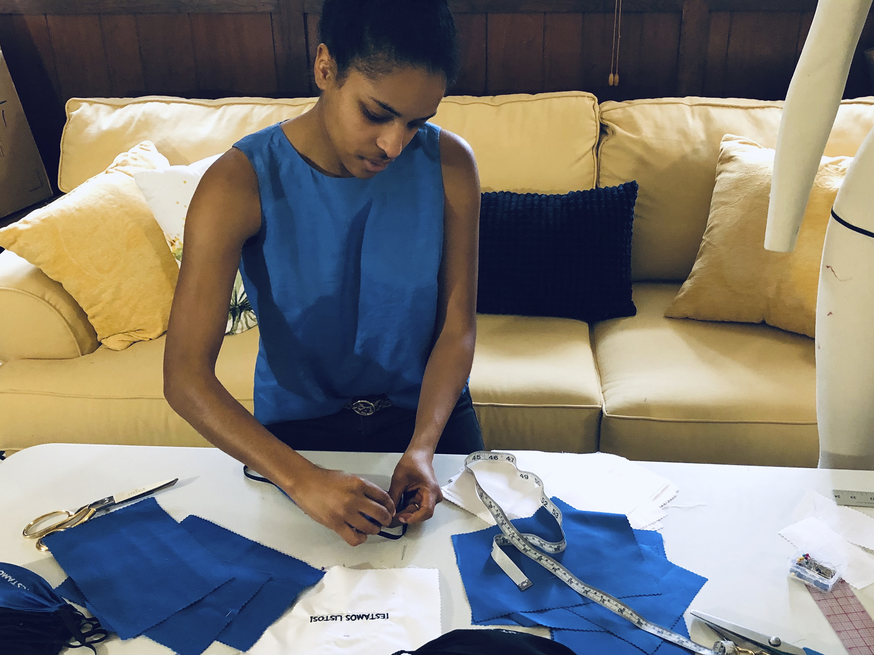 Volunteers sew masks for health workers facing shortages