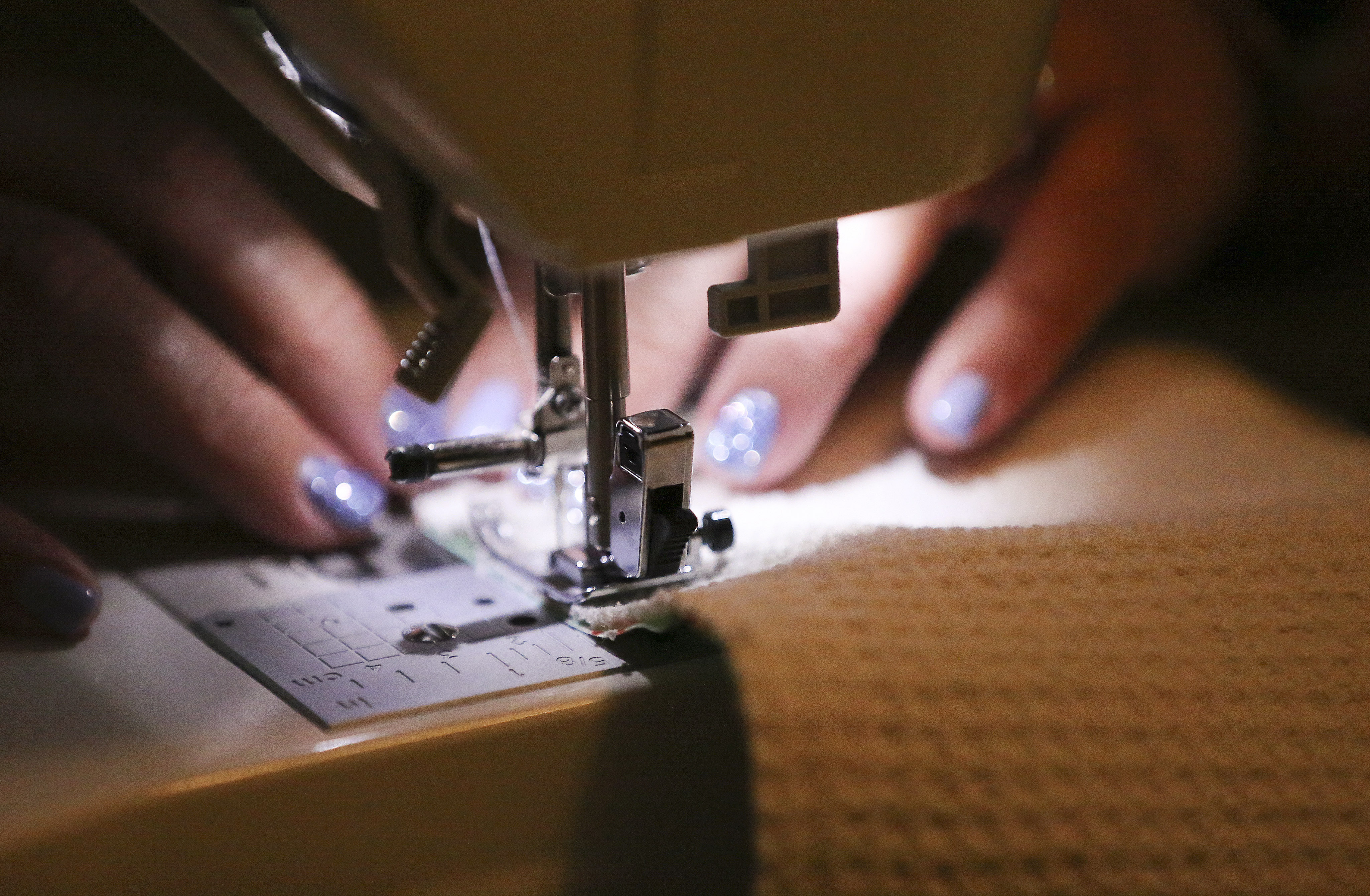 Signature Healthcare certified nursing assistant Stephanie Kinder makes protective masks at her home in Sandy on Saturday, March 21, 2020. She made masks for her colleagues because her company can no longer order them. (Photo: Jeffrey D. Allred, KSL)