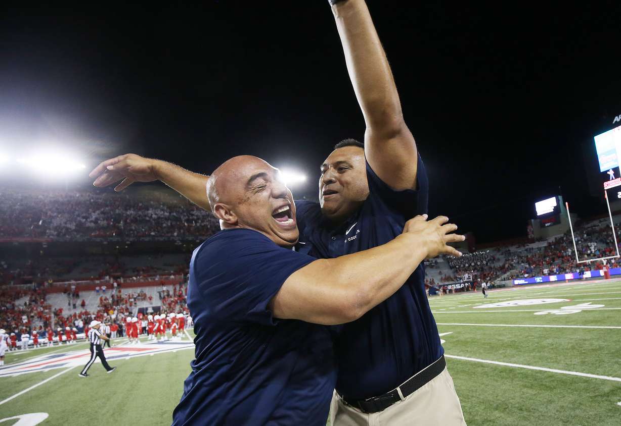 Brigham Young Cougars coach Kalani Sitake celebrates with support staff member Jasen Ah You after awin against the Arizona Wildcats in Tucson, Arizona, on Sunday, Sept. 2, 2018. Ah You will take on additional responsibilities in recruiting, Sitake said Tuesday during a conference call with local media. (Photo: Jeffrey D. Allred, KSL)