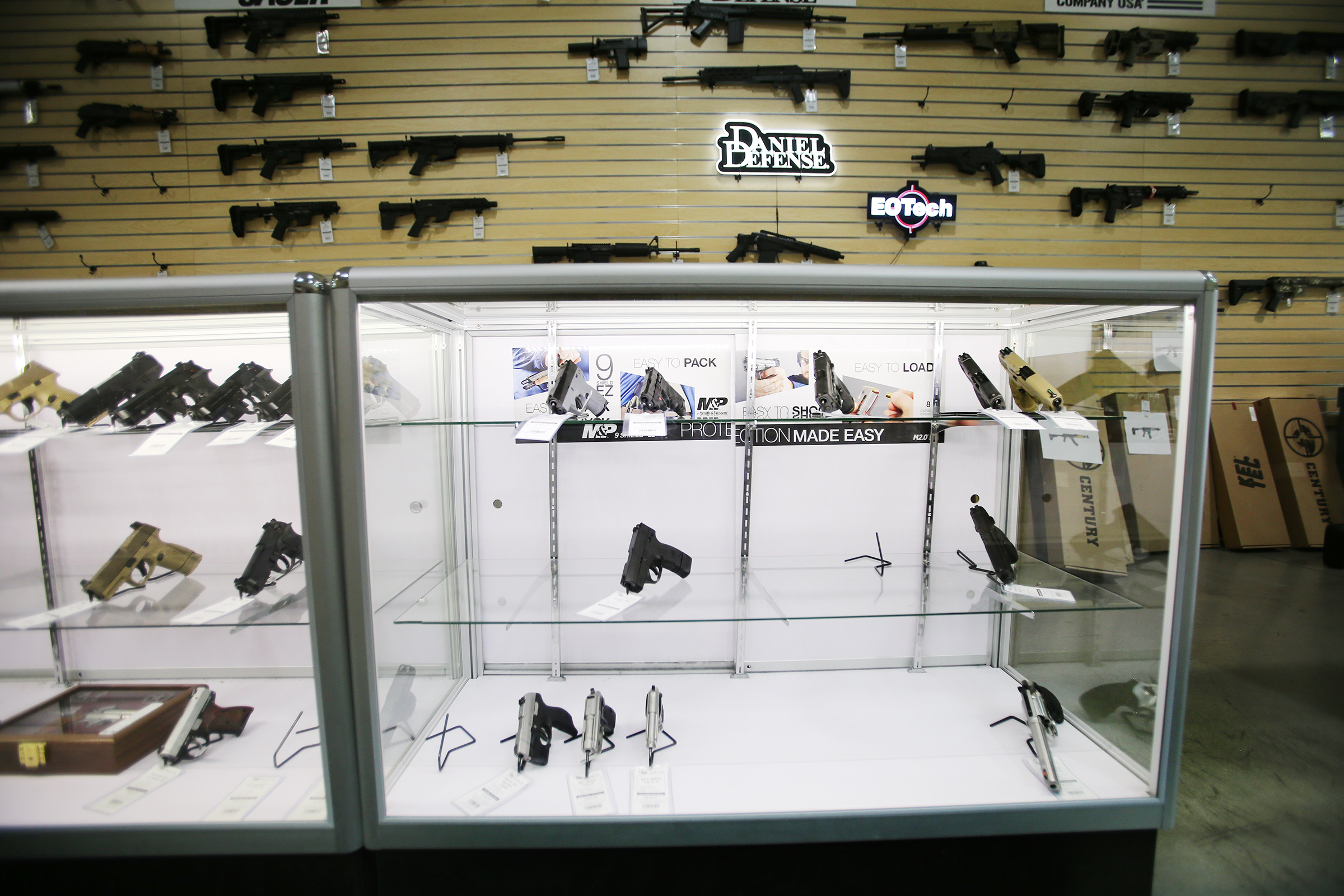 A display case at Impact Guns in Salt Lake City features empty spaces where guns that have been sold were once displayed on Tuesday, March 24, 2020. Many are buying guns and stocking up on ammunition during the coronavirus pandemic. (Photo: Scott G Winterton)