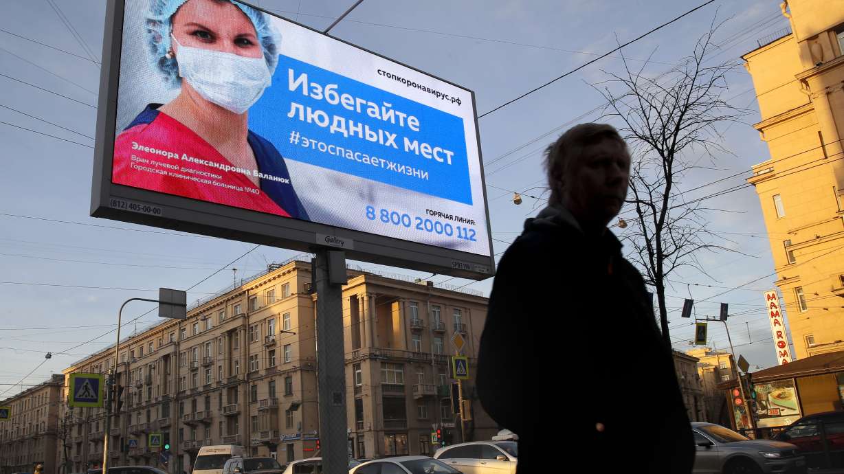 The Latest: Singapore penalizing social distancing violators