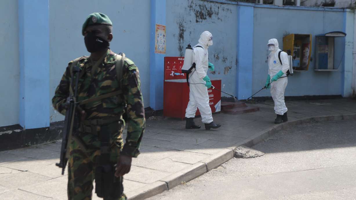 The Latest: Michigan executive order restores water service