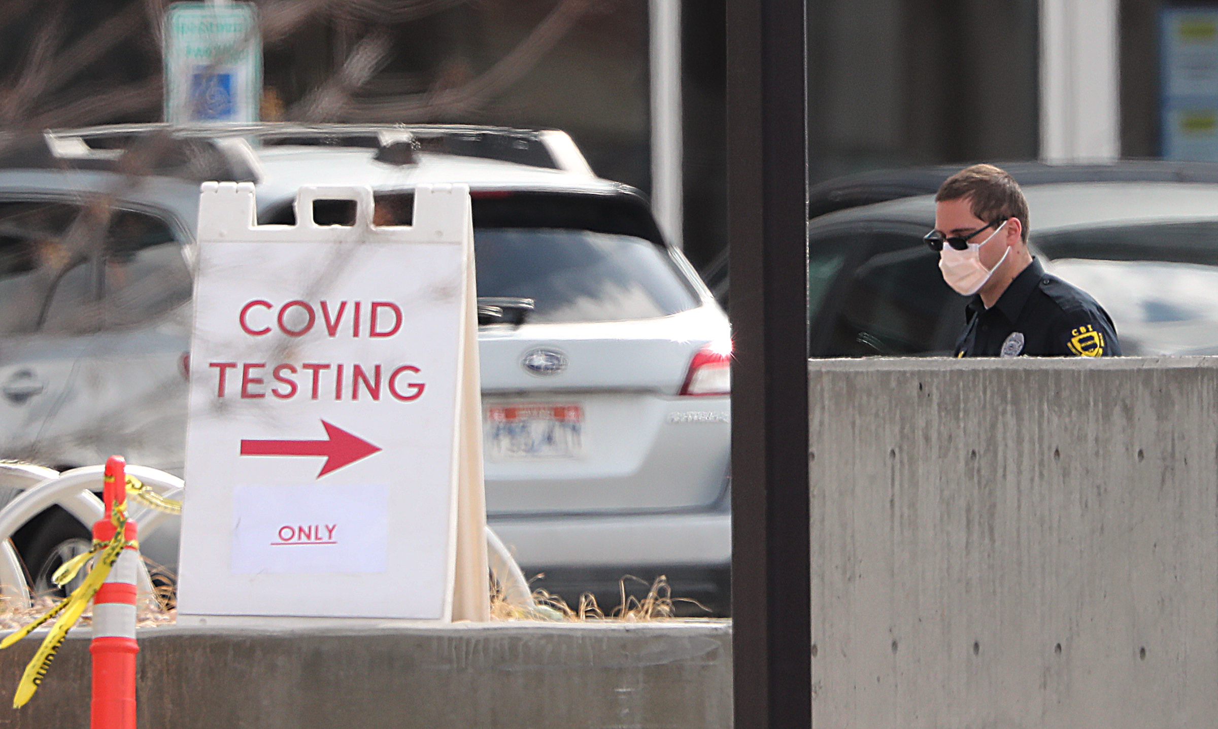 A security guard stands at the entrance of a testing station at the University of Utah Health's Sugar House Health Center in Salt Lake City on Wednesday, March 25, 2020. (Photo: Scott G Winterton, KSL)