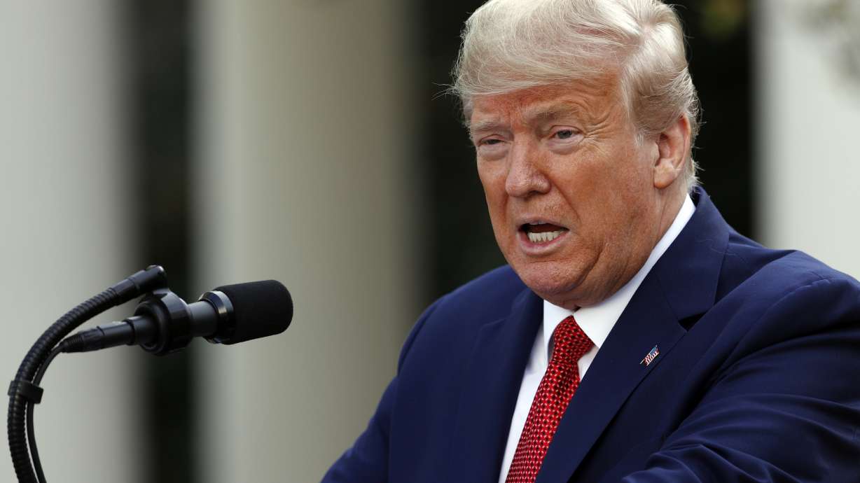 Trump defends extending virus guidelines as spread continues