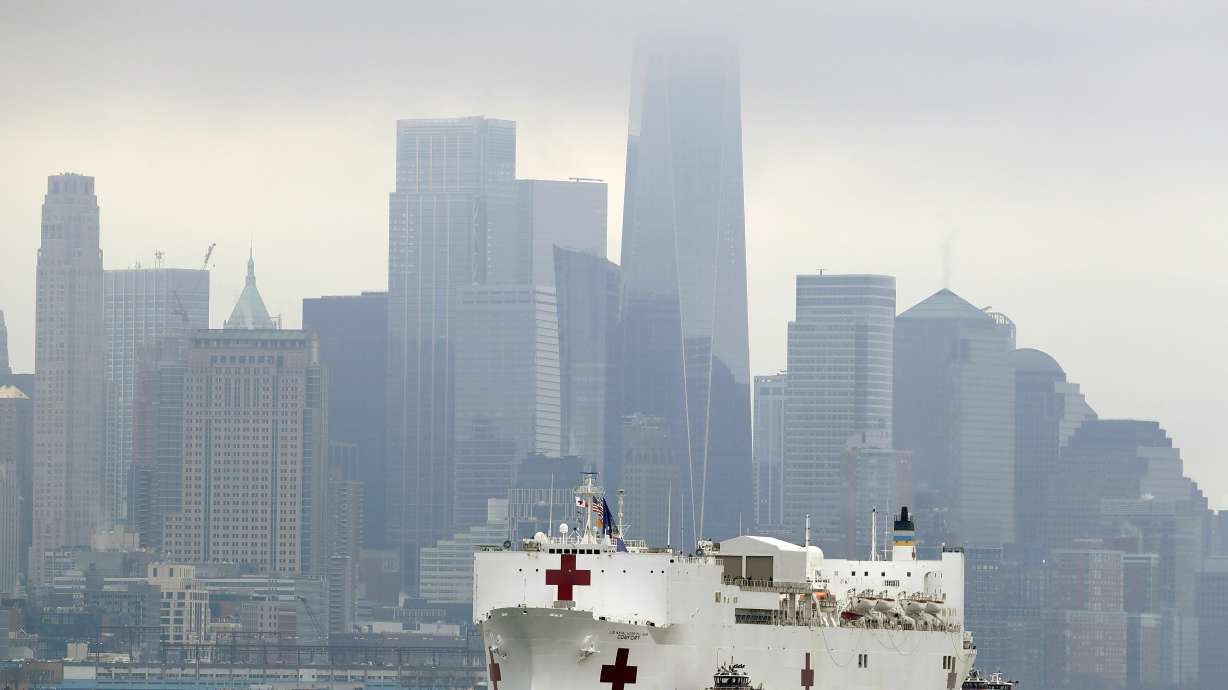 The Latest: China reports 36 new COVID-19 cases