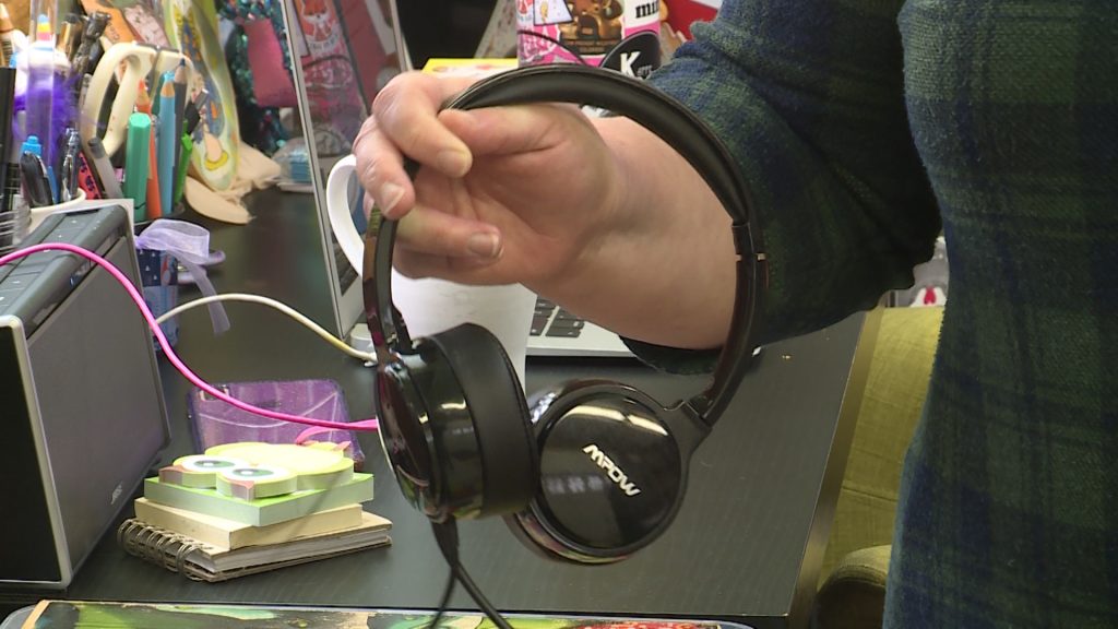 Telecommuter Christina Miller recommends getting noise-canceling headphones to help block distracting neighborhood noise. (Photo: KSL TV)