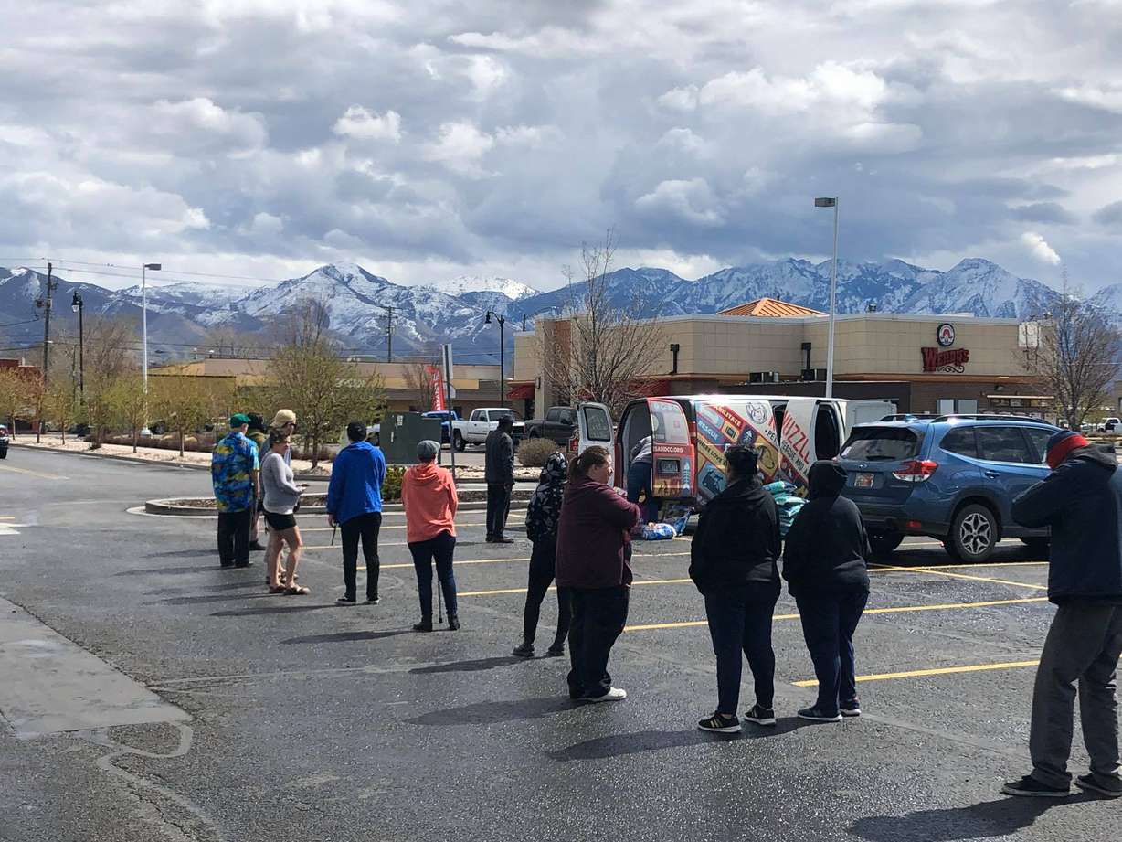 Residents picking up pet donations practicing social distancing while waiting in line at a Nuzzles and Co. Pop-up Pantry in Salt Lake City Tuesday, March 31, 2020. (Photo: Nuzzles and Co.)
