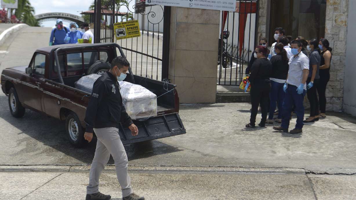 In Ecuador, families wait with their dead as bodies pile up