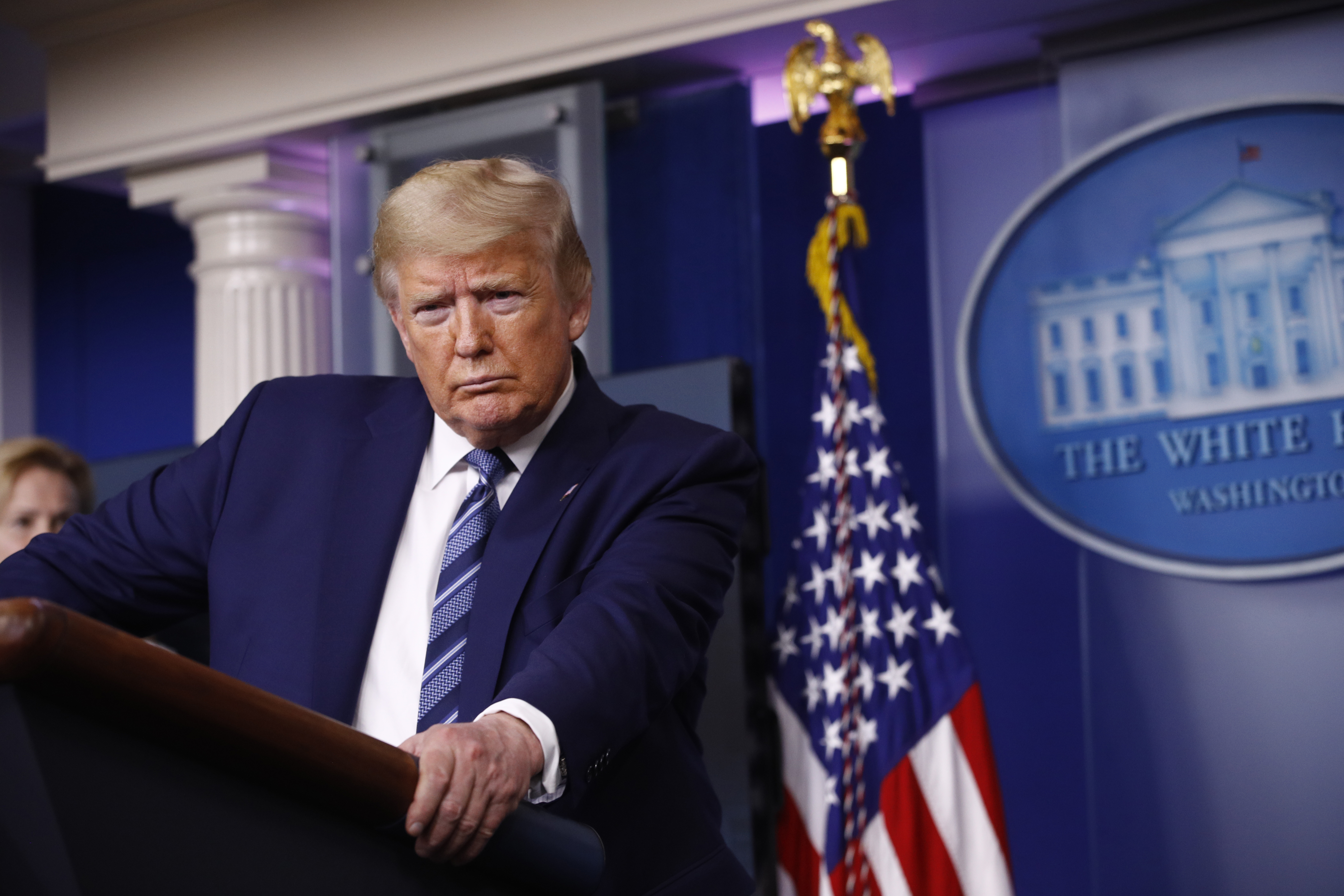 Trump tempers officials' grave assessments with optimism
