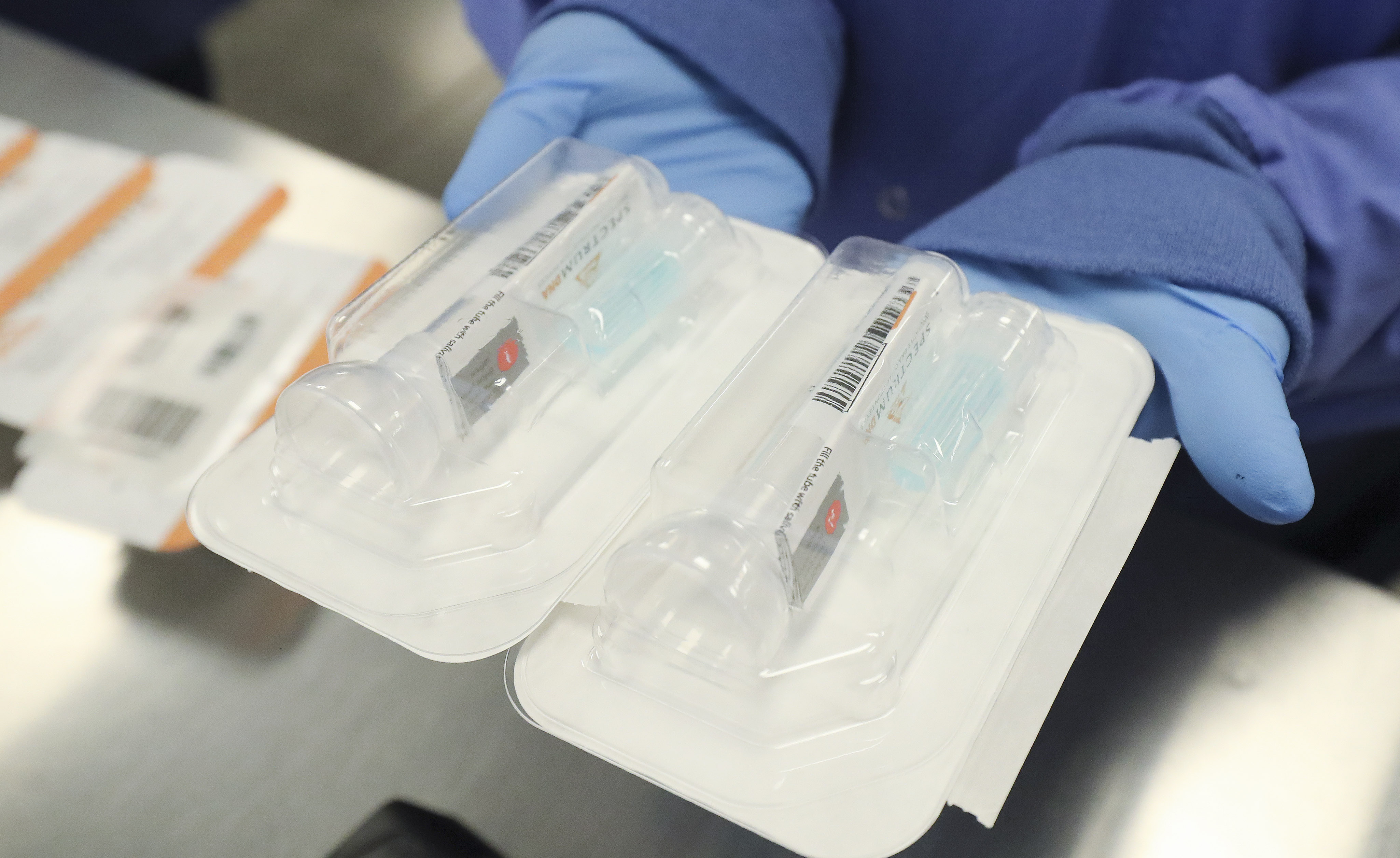 Saliva collection devices are held at Spectrum DNA in Draper on Tuesday, April 7, 2020. The Utah company has developed the test kit to detect the coronavirus in patients’ saliva. (Photo: Jeffrey D. Allred)