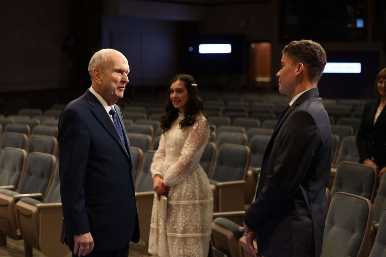 Teenagers Laudy Ruth Kaouk and Enzo Serge Petelo visit with President Russell M. Nelson of The Church of Jesus Christ of Latter-day Saints prior to their speaking in the Saturday evening session of general conference, April 4, 2020. Traditionally, the speakers at general conference have been general authorities and general officers of the church. (The Church of Jesus Christ of Latter-day Saints)