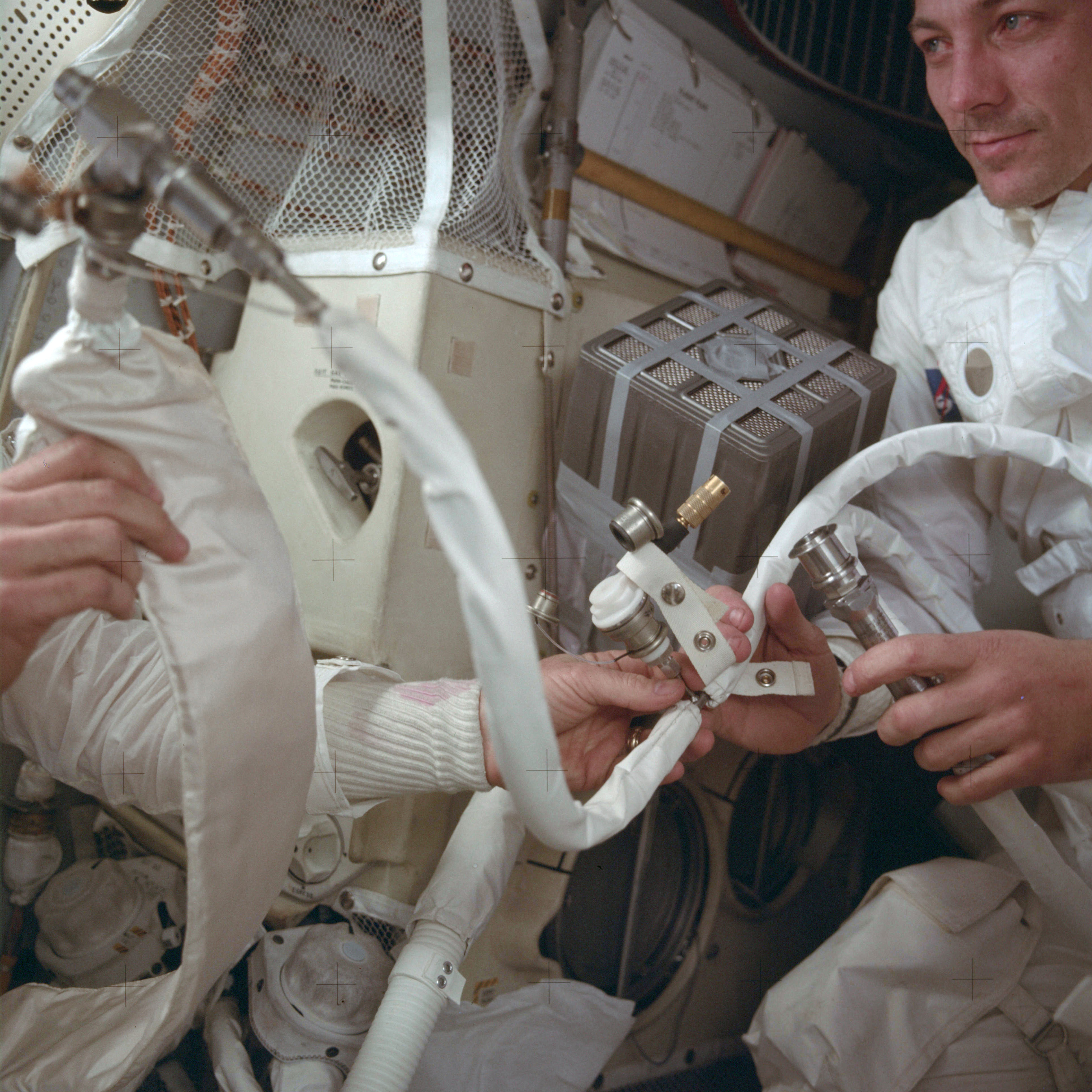 In this April 1970 photo provided by NASA, Apollo 13 command module pilot John Swigert helps to hook up a lithium hydroxide canister in the lunar module, in an effort to get rid of carbon dioxide in the cabin as the spacecraft attempts to return to Earth. (Photo: NASA via AP)