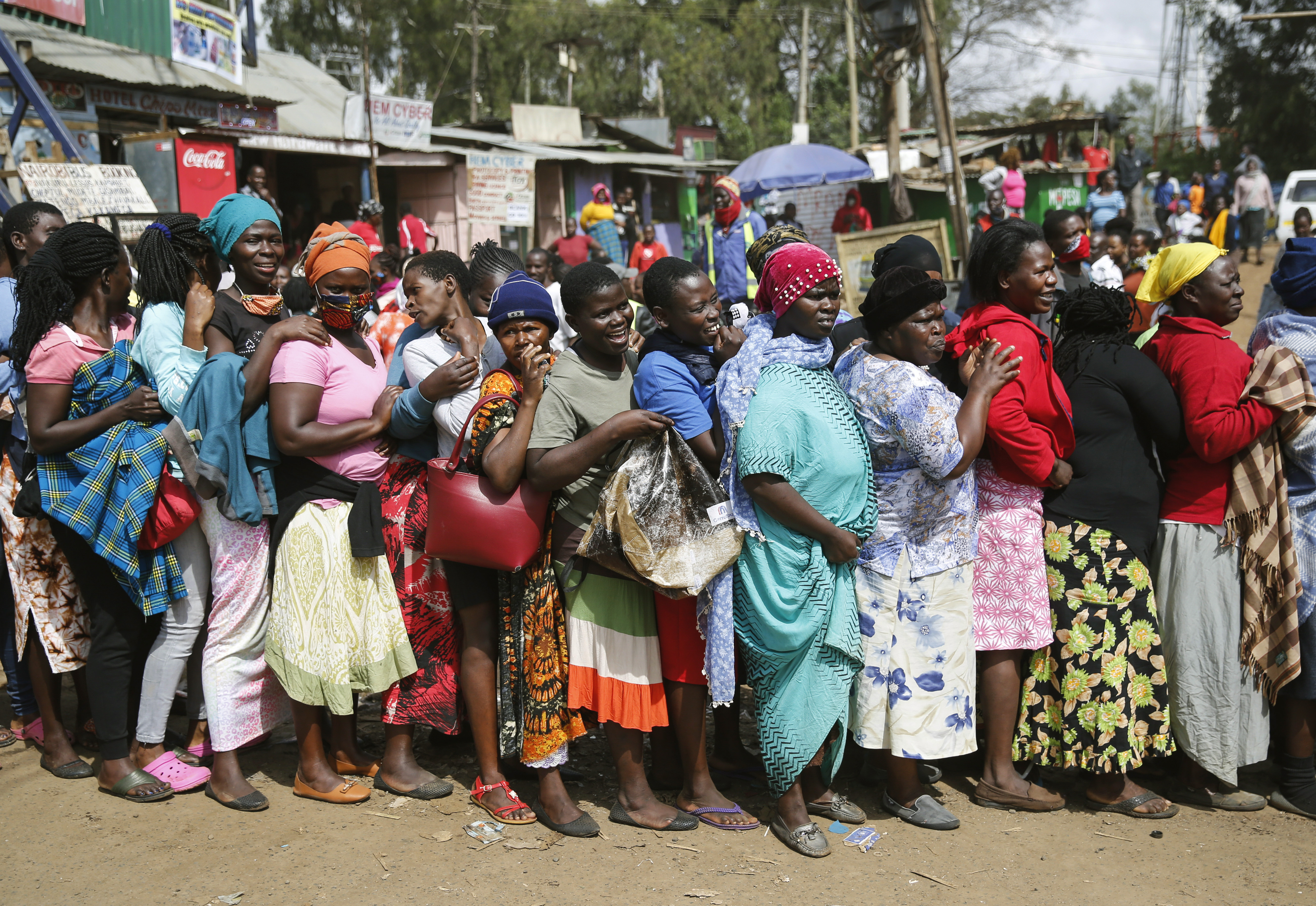 Stampede in Kenya as slum residents surge for food aid