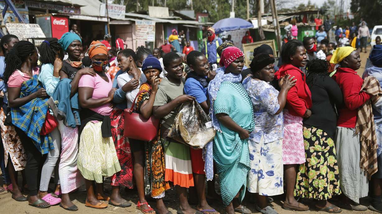Stampede in Kenya as slum residents surge for food aid