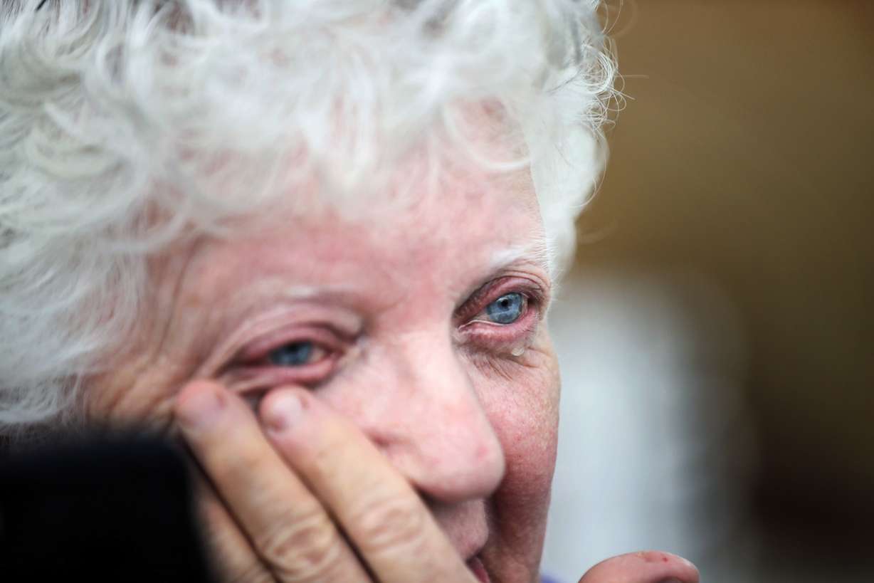 Emma Pritchett wipes a tear away as she looks through her home the day after a tornado hit, Monday, April 13, 2020, in Chatsworth, Ga. (Brynn Anderson, AP Photo)