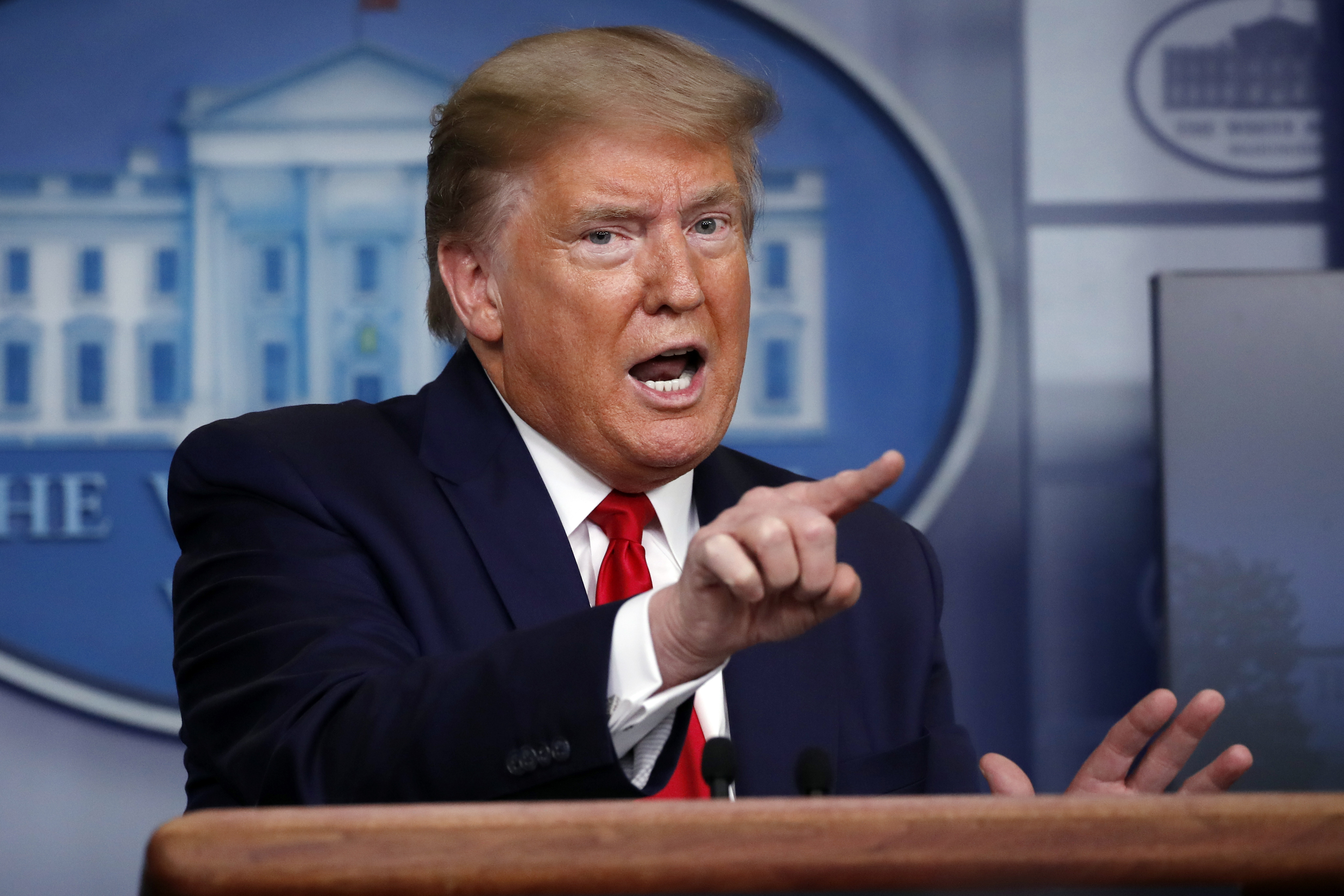 Trump reverses course on power to 'reopen' states amid virus