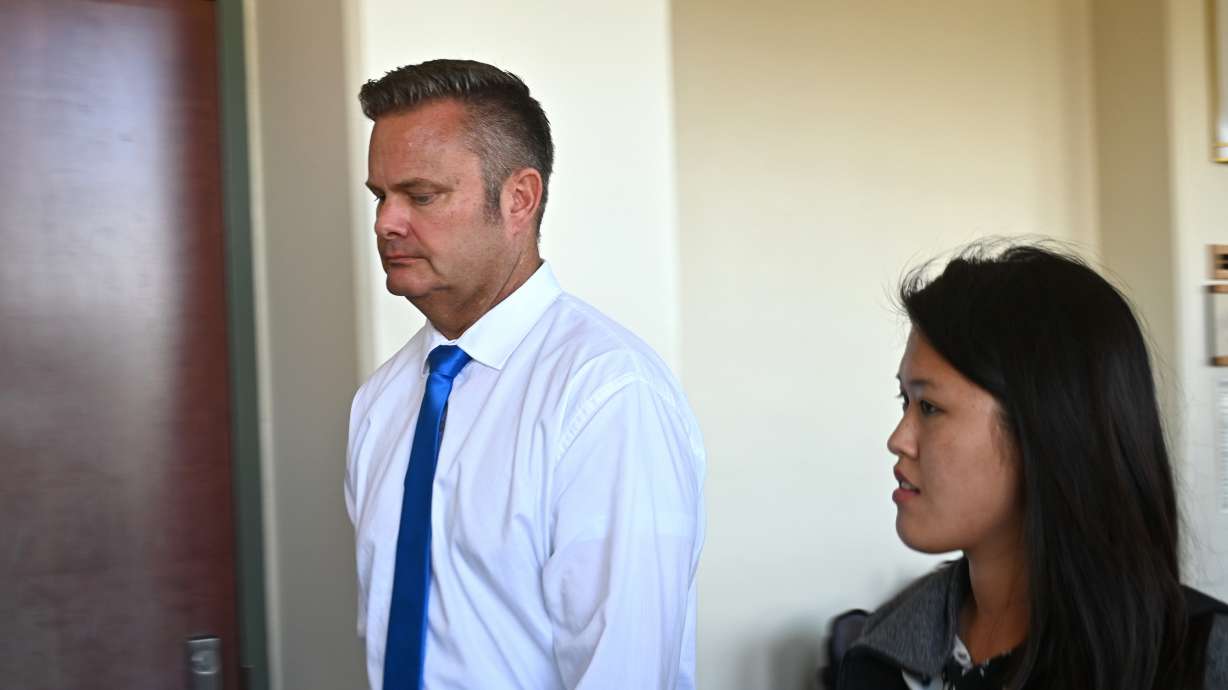 In this Feb. 21, 2020 photo, Chad Daybell, Lori Vallow's husband, walks into court for his wife's hearing on child abandonment and other charges in Lihue, Hawaii. The murder trial for Chad Daybell will not be held in January, a judge ruled Friday.