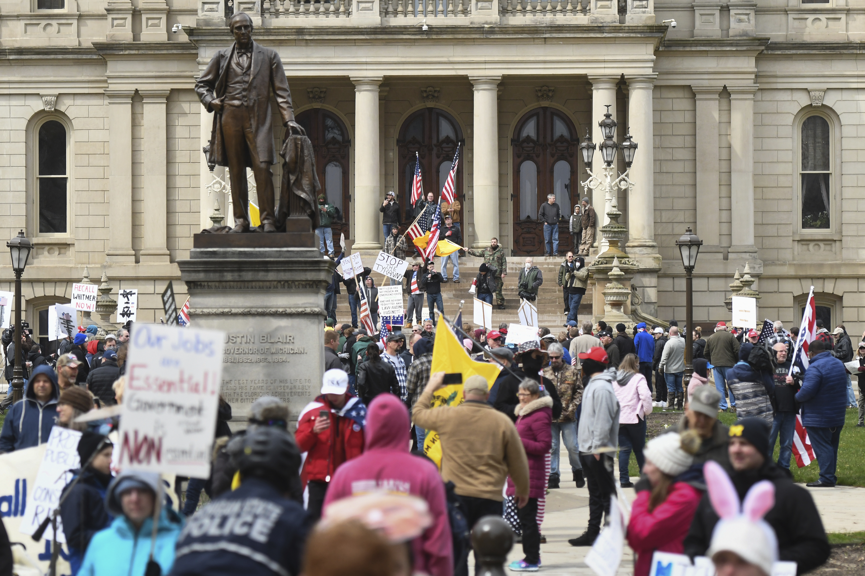 Thousands protest Michigan governor's social distance order