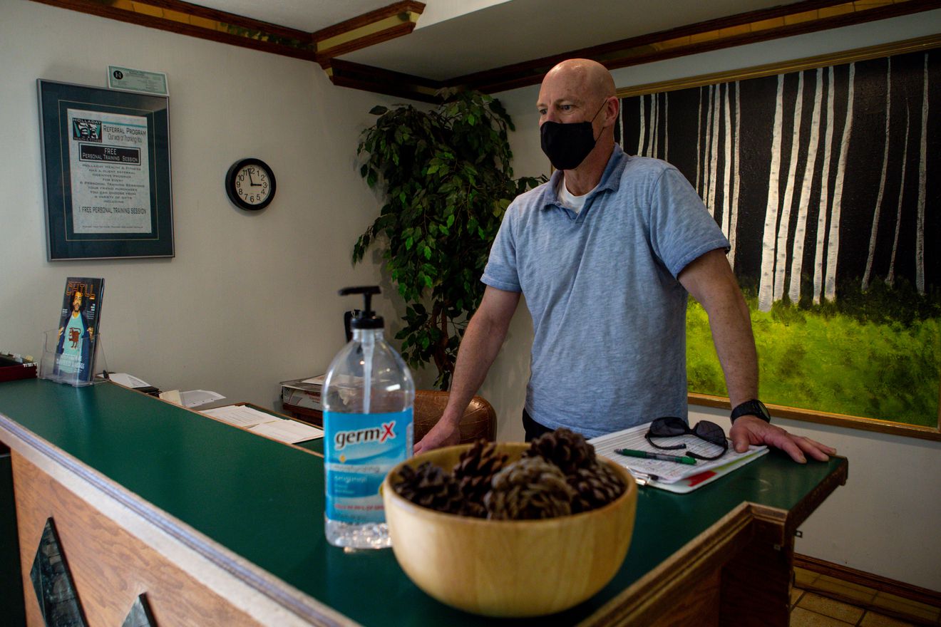 Rob Dunfield, owner of Holladay Health and Fitness, poses for a portrait at the gym’s entrance in Holladay on Monday, April 20, 2020. (Photo: Jeffrey D. Allred, KSL)